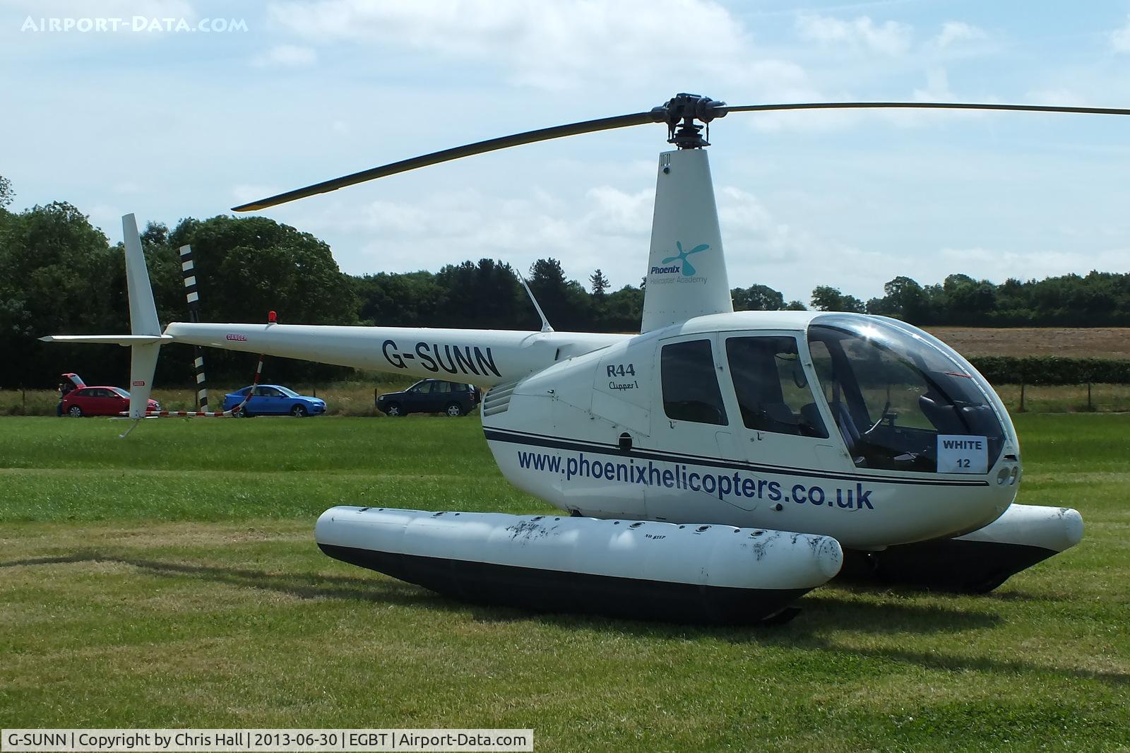 G-SUNN, 2004 Robinson R44 Clipper C/N 1367, being used for ferrying race fans to the British F1 Grand Prix at Silverstone