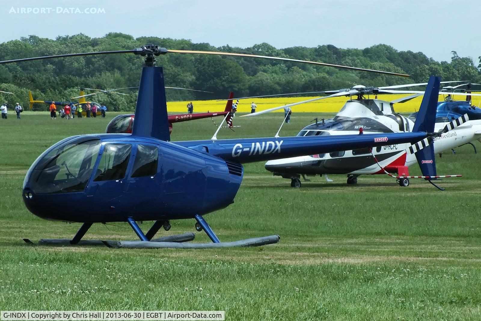 G-INDX, 2004 Robinson R44 Clipper II C/N 10491, being used for ferrying race fans to the British F1 Grand Prix at Silverstone