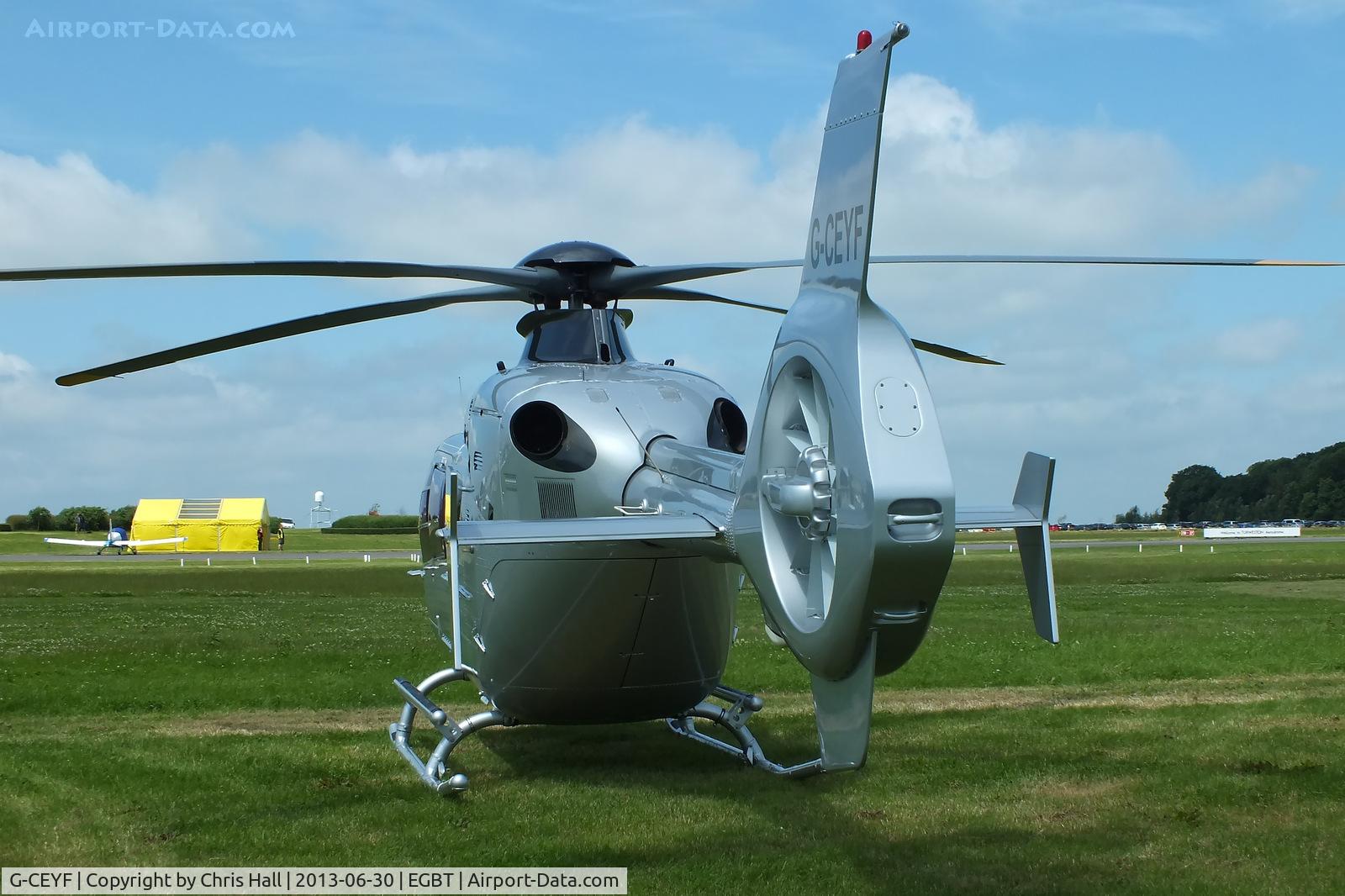 G-CEYF, 1999 Eurocopter EC-135T-1 C/N 0115, being used for ferrying race fans to the British F1 Grand Prix at Silverstone