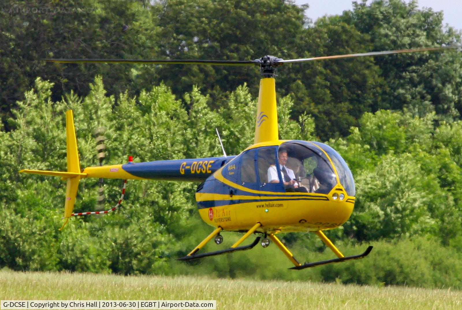 G-DCSE, 1999 Robinson R44 Astro C/N 0659, being used for ferrying race fans to the British F1 Grand Prix at Silverstone