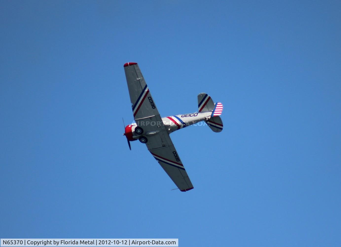 N65370, 1941 North American SNJ-2 Texan C/N 2562, Geico SNJ-2 over Daytona Beach