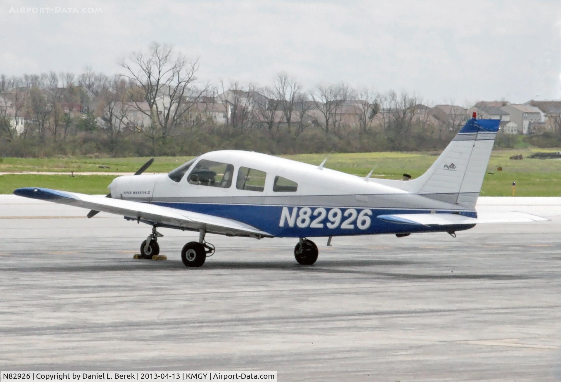 N82926, 1980 Piper PA-28-161 C/N 28-8116080, With a lot of finagling, I was able to capture this birdie out on the tarmac through a chain-link fence.