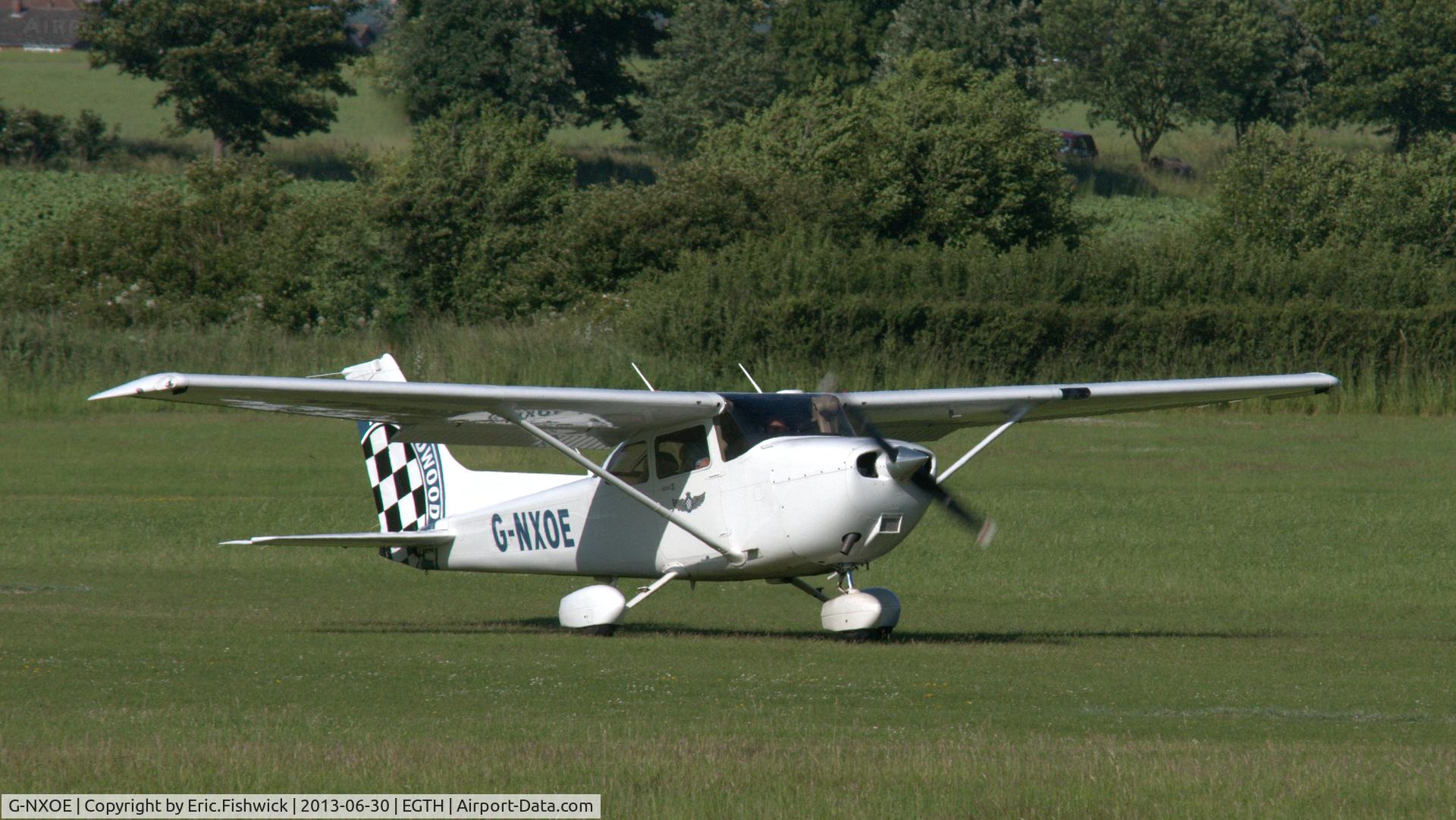 G-NXOE, 2010 Cessna 172S C/N 172S11002, 43. G-NXOE departing the Shuttleworth Military Pagent Flying Day, 30 June 2013.