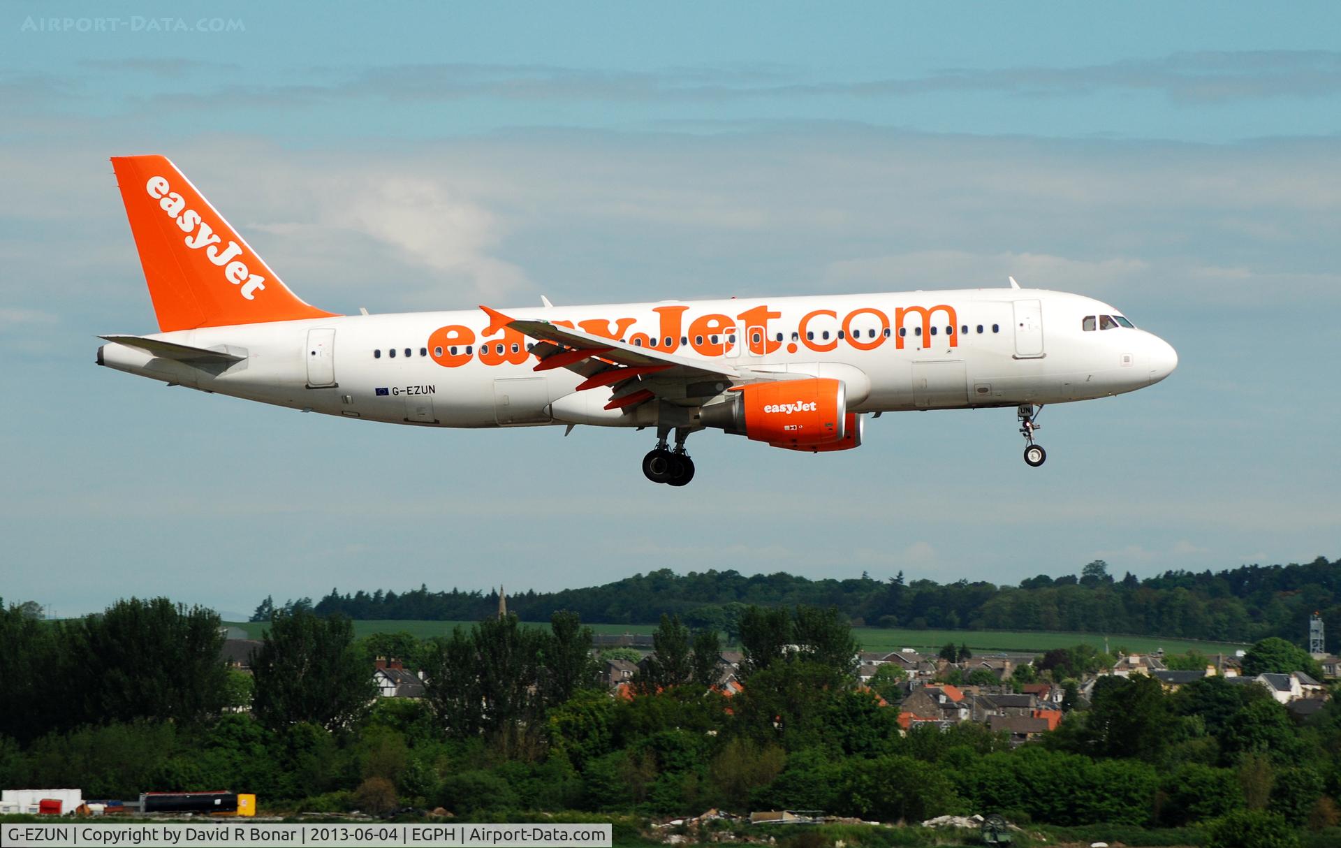 G-EZUN, 2012 Airbus A320-214 C/N 5046, Short finals for a 06 arrival. The village of Kirkliston in the background.