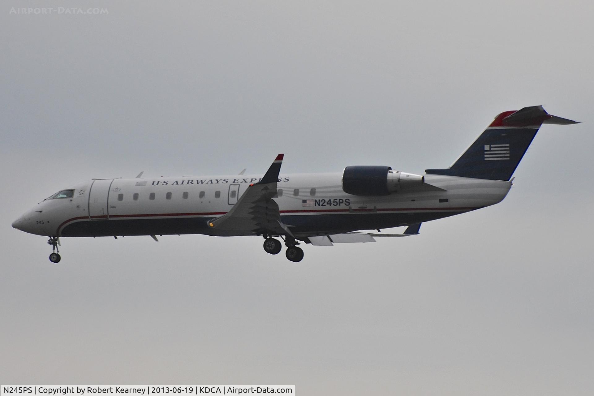 N245PS, 2004 Bombardier CRJ-200ER (CL-600-2B19) C/N 7919, On short finals for r/w 1