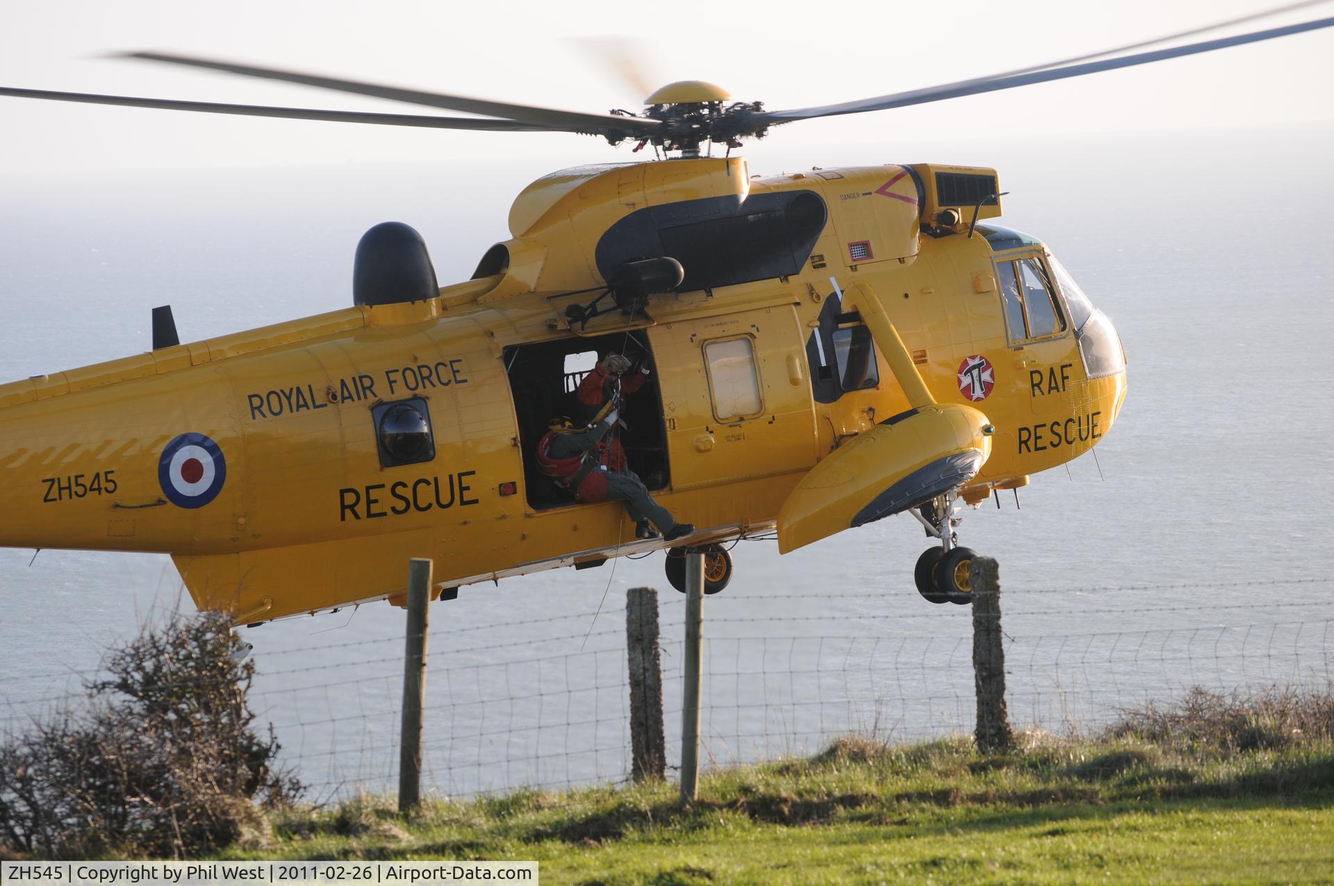 ZH545, 1997 Westland Sea King HAR.3A C/N WA1011, conducting a rescue at Beer Head Devon