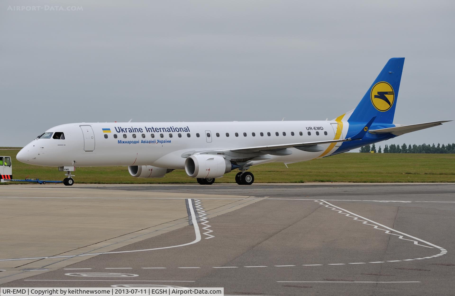 UR-EMD, 2013 Embraer 190STD (ERJ-190-100) C/N 19000602, Being towed from spray in Ukraine International colour scheme.