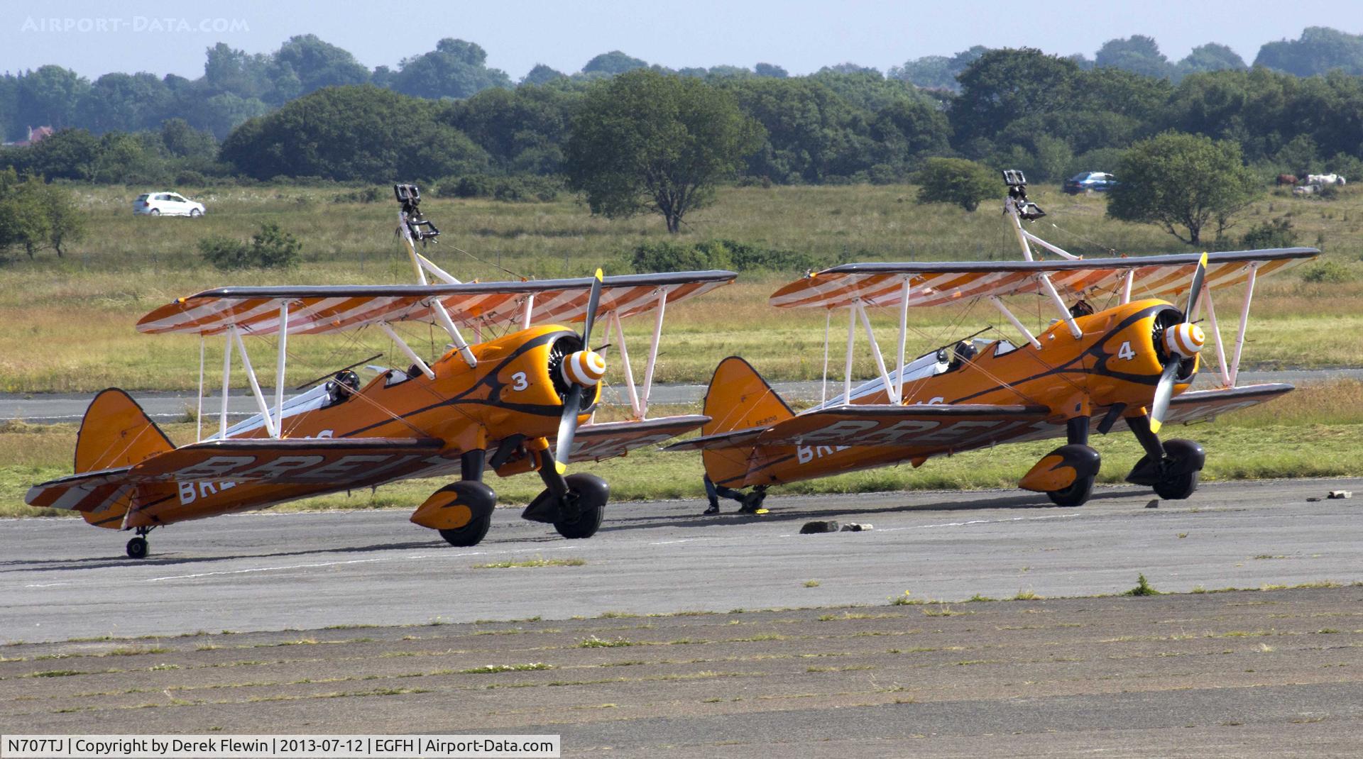 N707TJ, 1943 Boeing A75N1(PT17) C/N 75-950, Breitling wing Walkers Display Team on stand at EGFH, also seen is, SE-BOG.