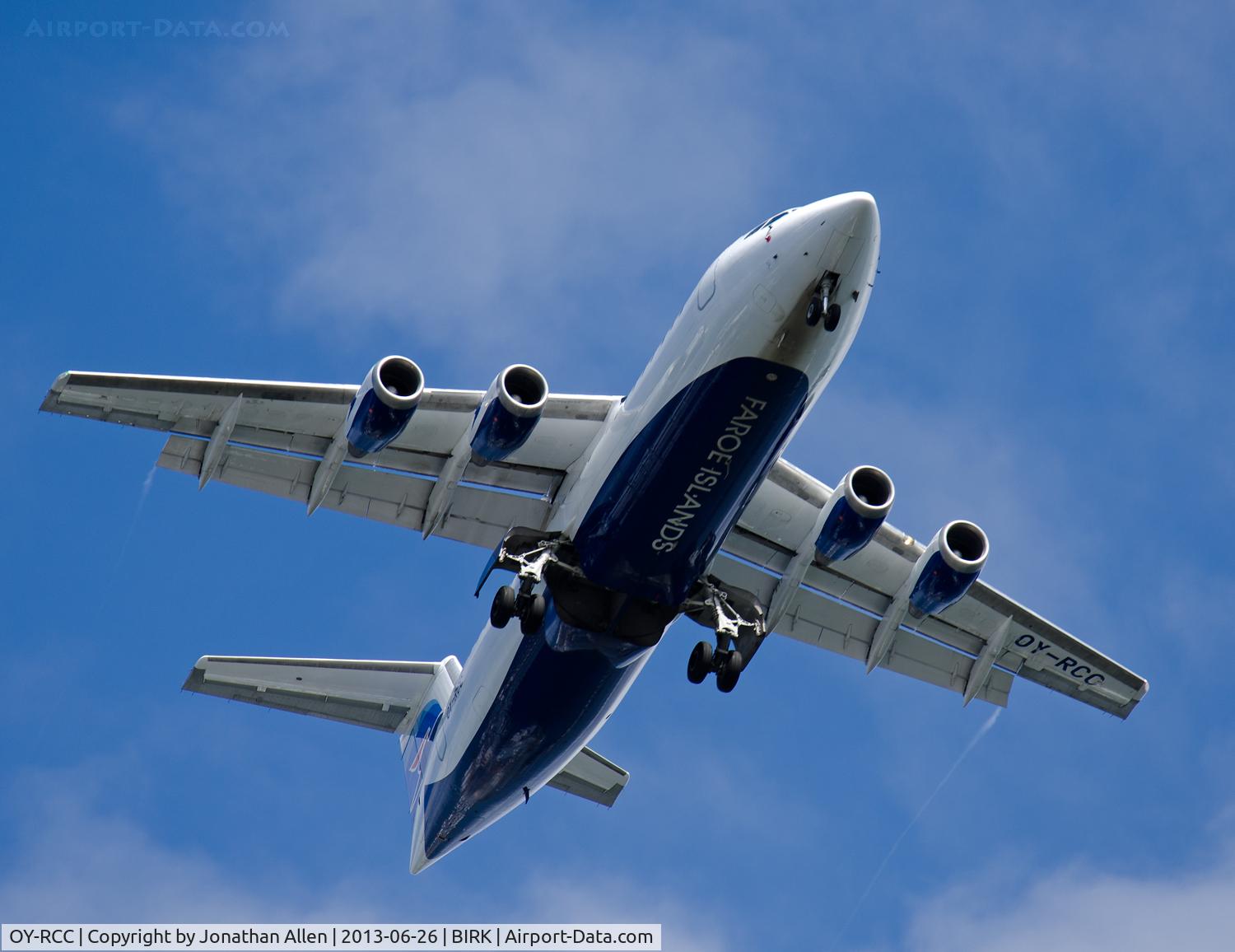 OY-RCC, 1999 British Aerospace Avro 146-RJ100 C/N E3357, Flying over Reykjavik on approach to the domestic airport.