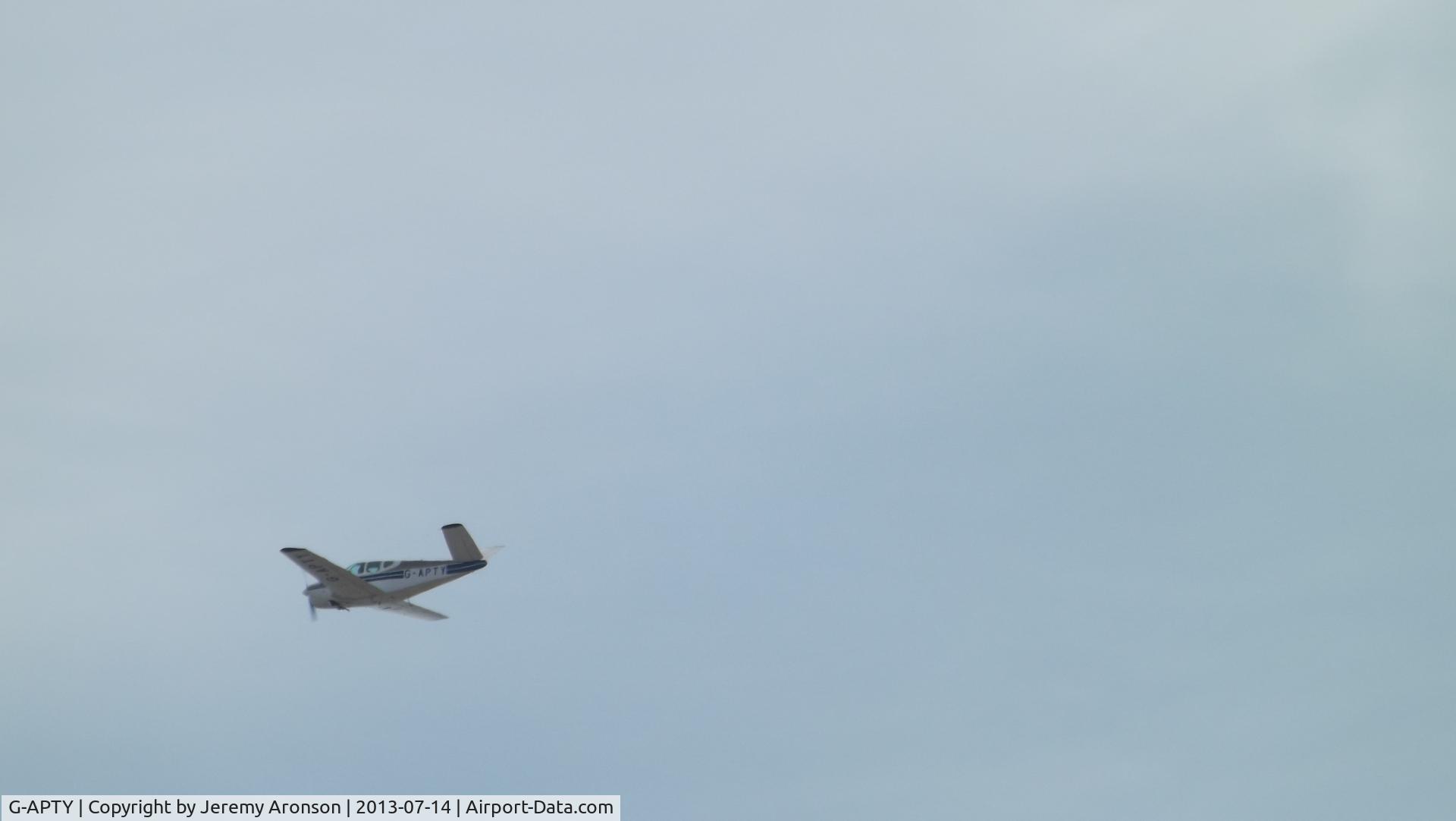 G-APTY, 1956 Beech G35 Bonanza Bonanza C/N D-4789, Near St Annes Beach - while sunbathing this plane flew past