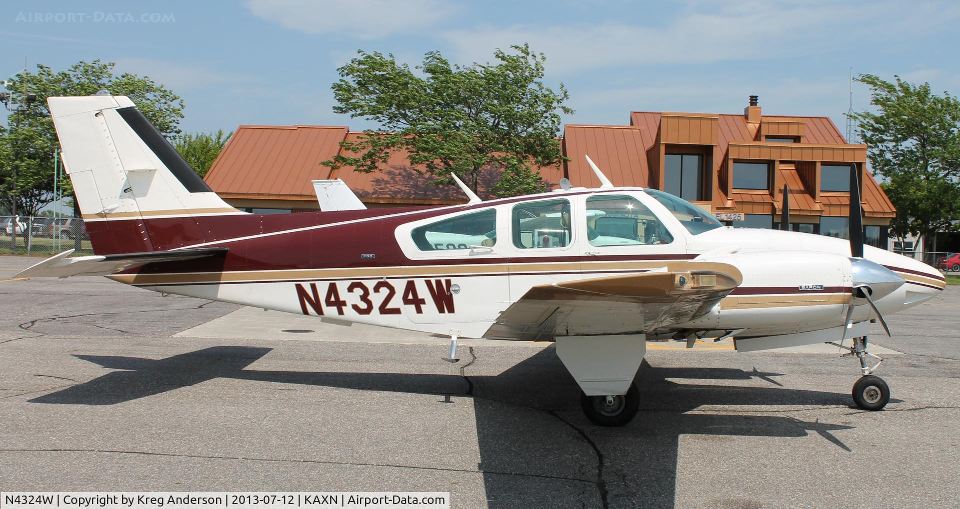 N4324W, 1974 Beech E-55 Baron C/N TE-966, Beech E-55 Baron at the fuel pumps.