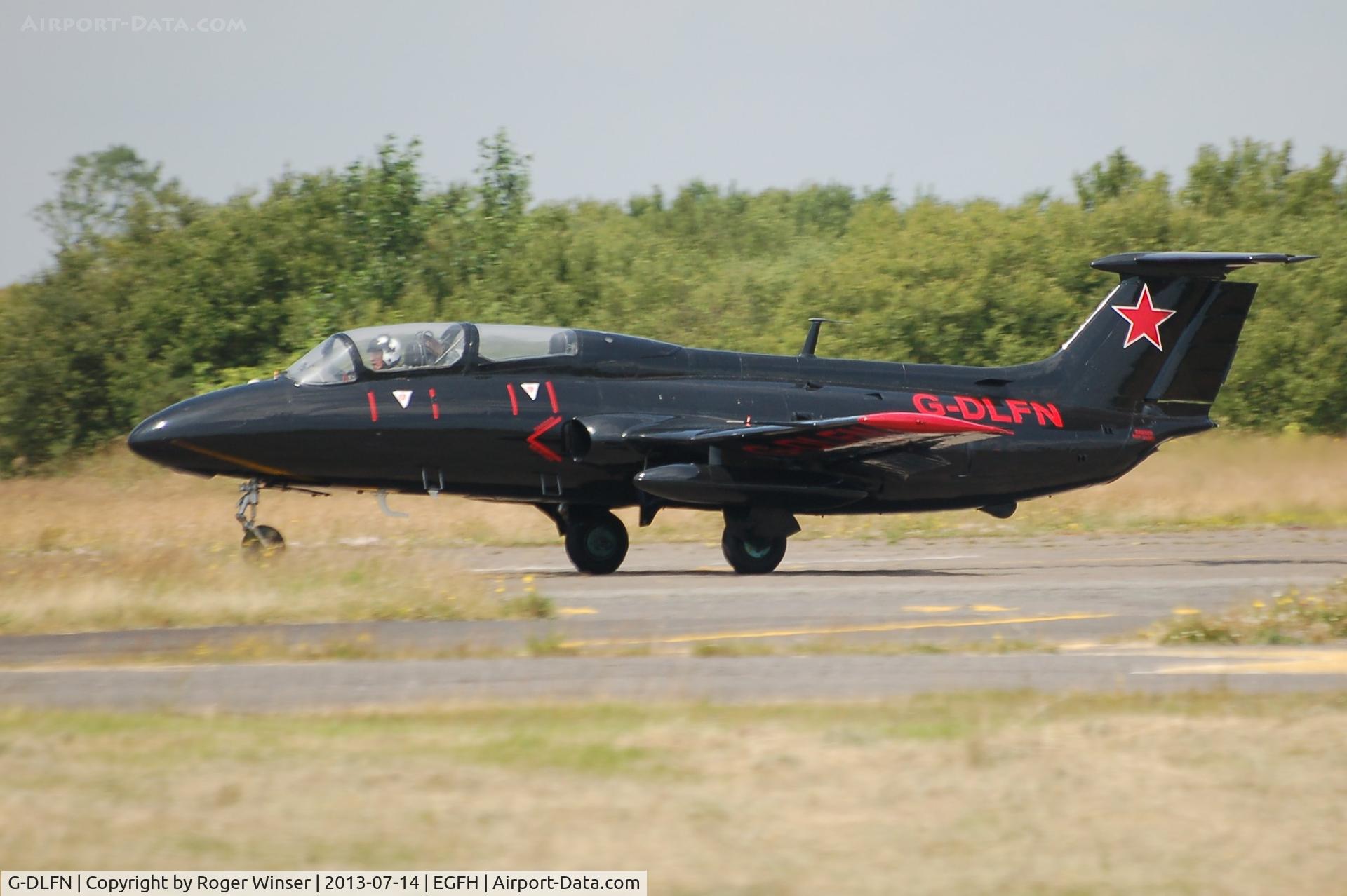 G-DLFN, 1972 Aero L-29 Delfin C/N 294872, Rebel 1 of the Red Star Rebels formation aerobatics team departing to display on the second day of the of the Wales National Air Show, Swansea Bay.
