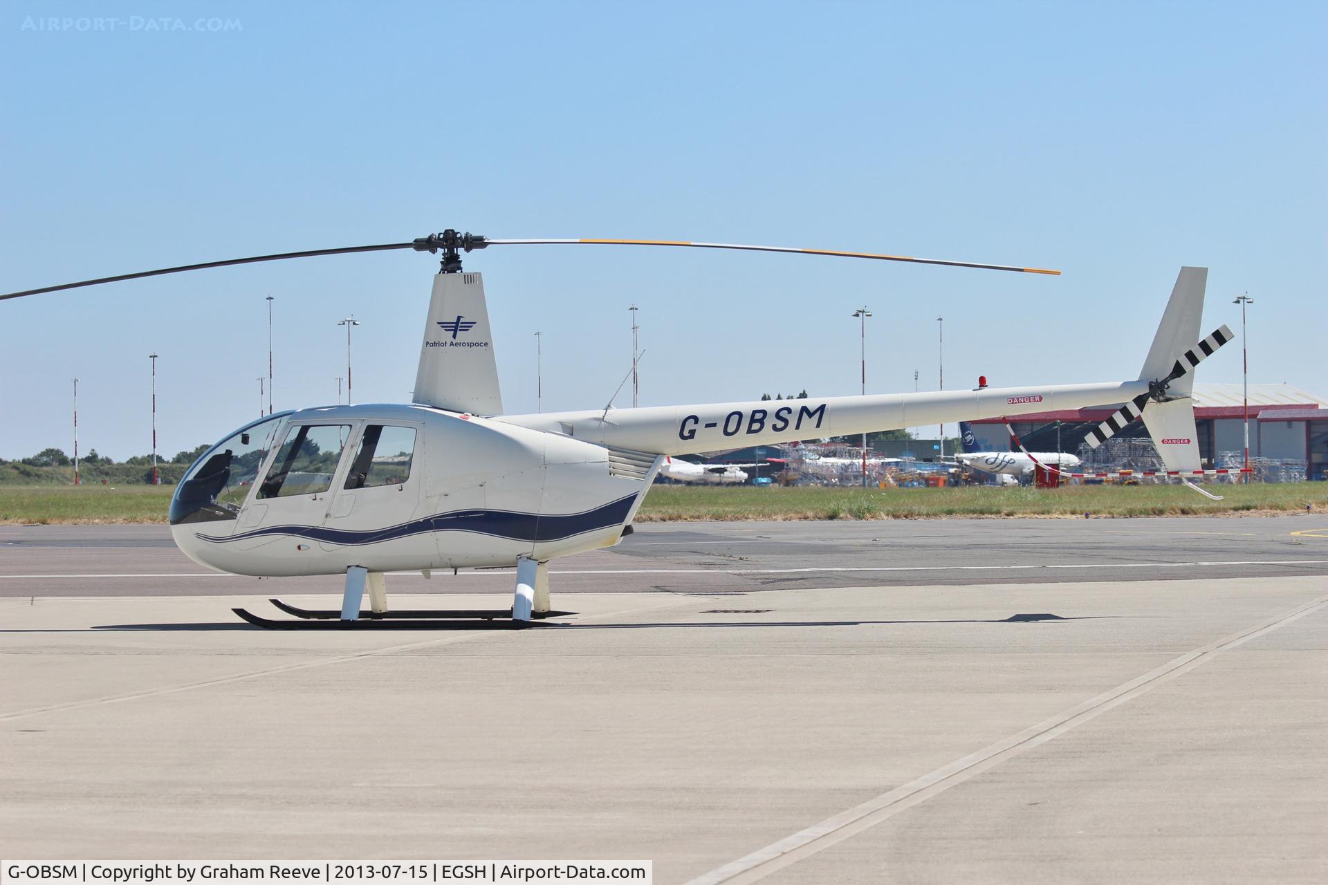 G-OBSM, 2001 Robinson R44 Raven C/N 1030, Parked at Norwich.