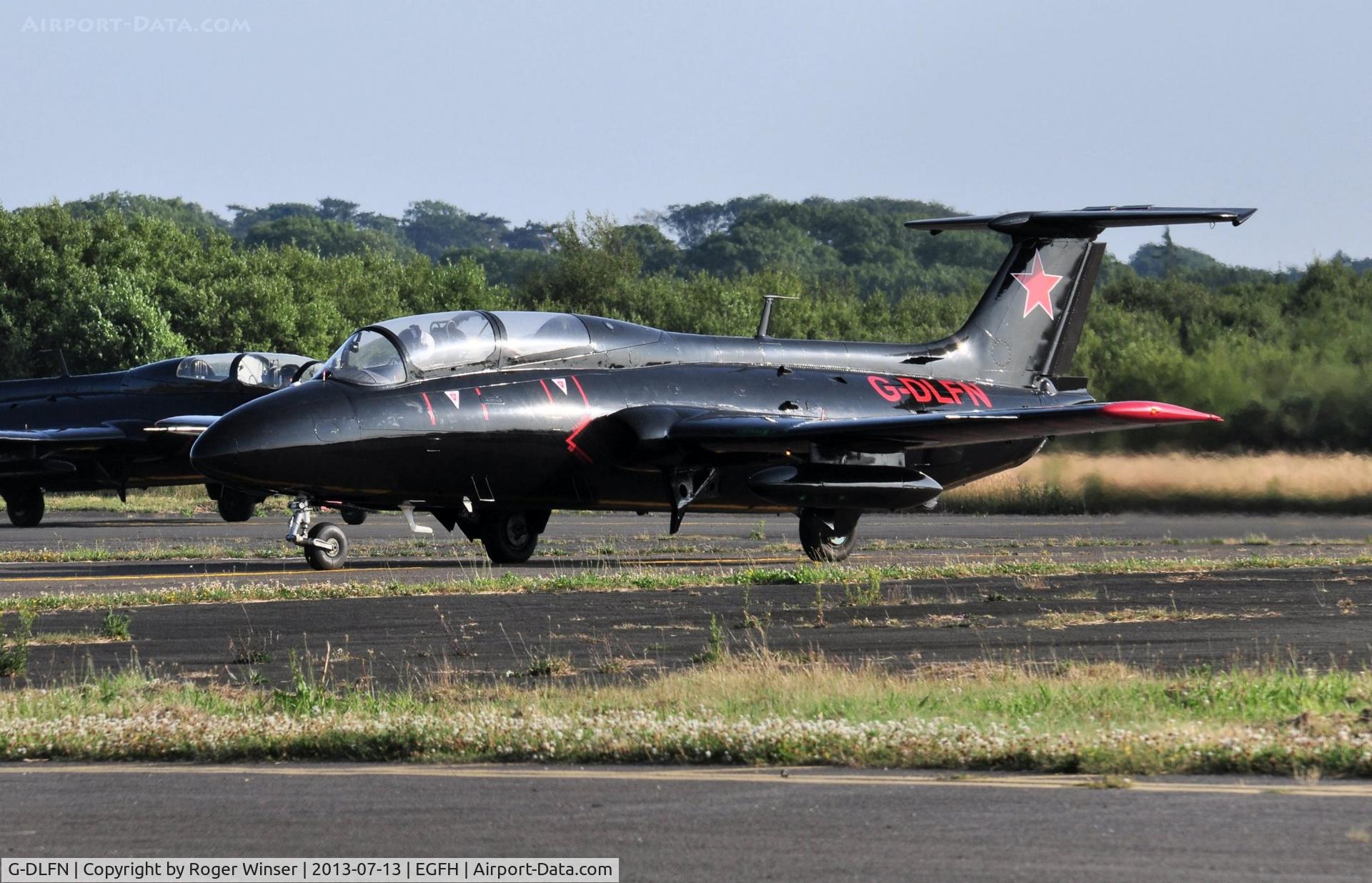 G-DLFN, 1972 Aero L-29 Delfin C/N 294872, Rebel 1. Aero Delfin of the Red Star Rebels formation team returning to it's temporary base at Swansea Airport after displaying at the RNAS Yeovilton Air Day. Rebel 2 (G-BYCT) following Rebel 1 to the apron.