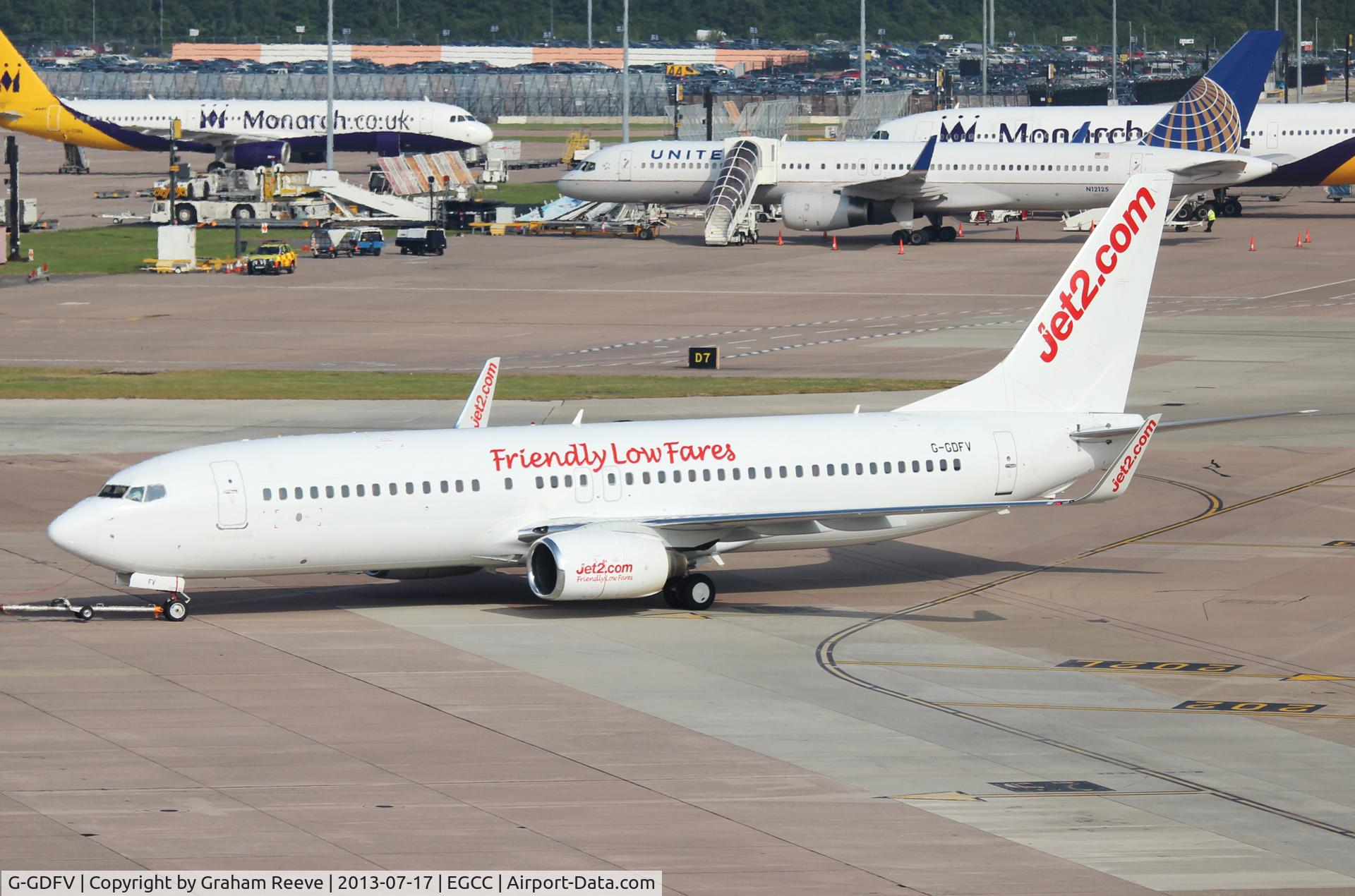 G-GDFV, 1998 Boeing 737-85F C/N 28821, Under tow at Manchester.