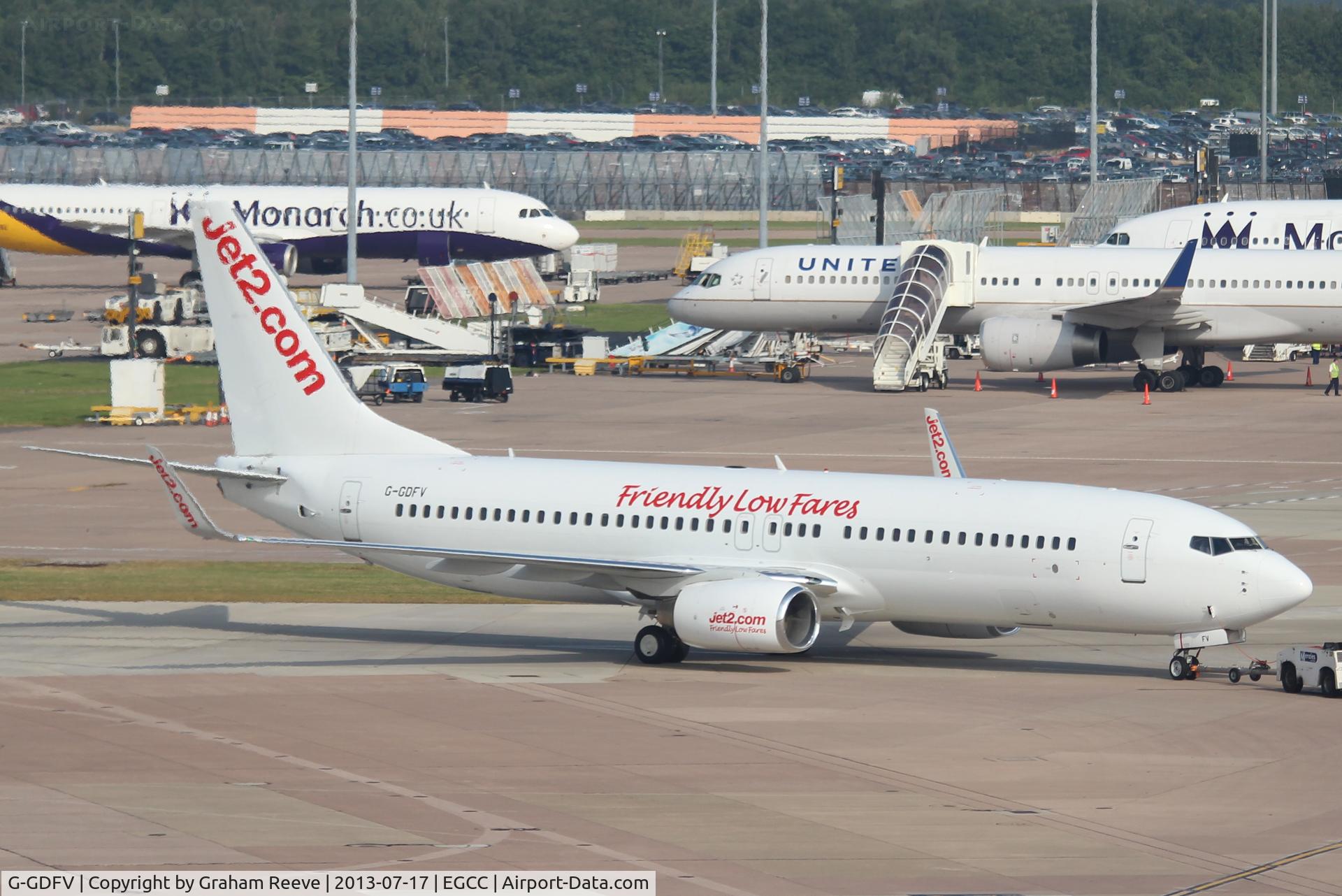 G-GDFV, 1998 Boeing 737-85F C/N 28821, Under tow at Manchester.