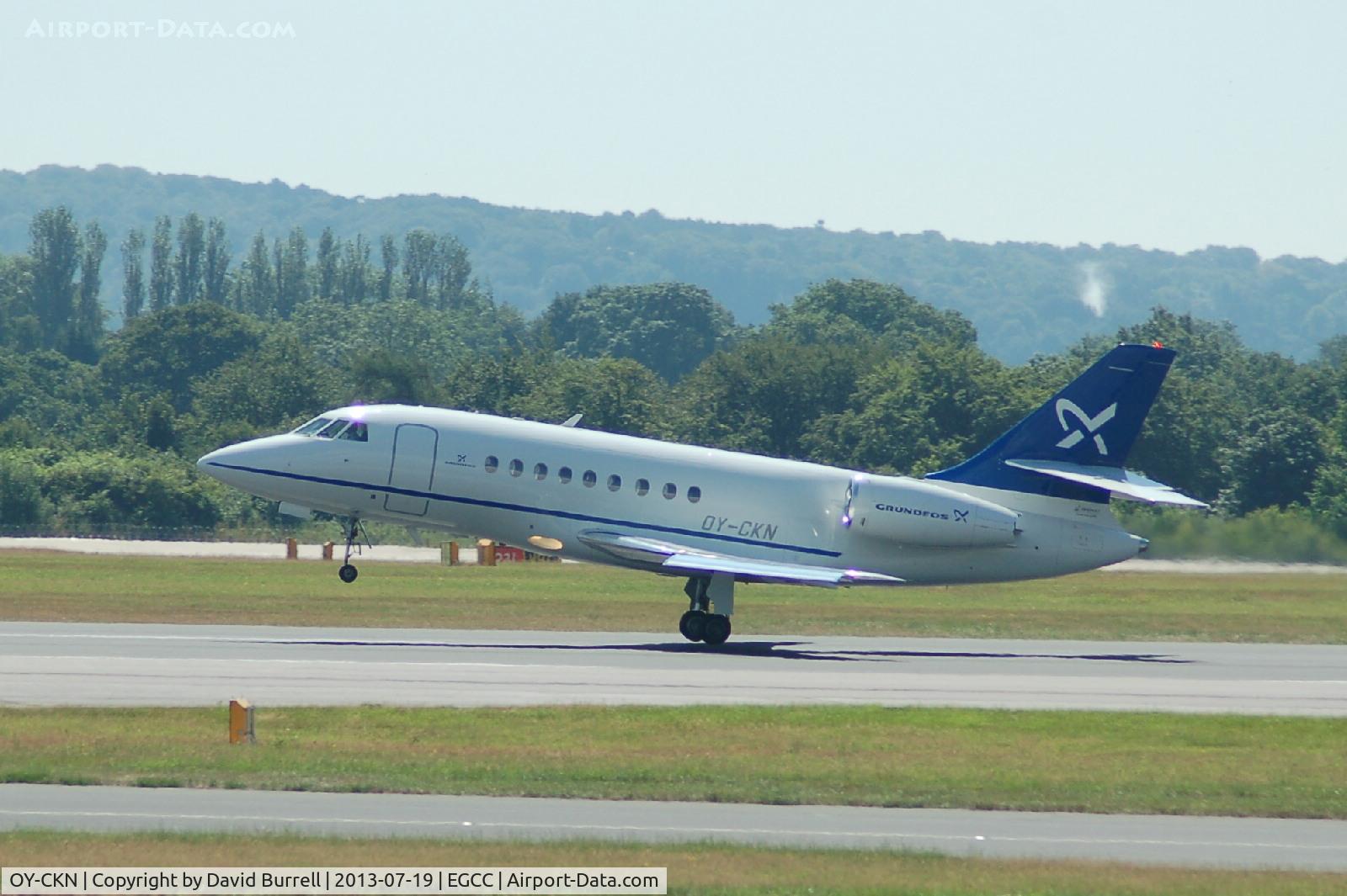 OY-CKN, 1998 Dassault Falcon 2000 C/N 76, Dasault Falcon OY-CKN taking off form Manchester Airport.