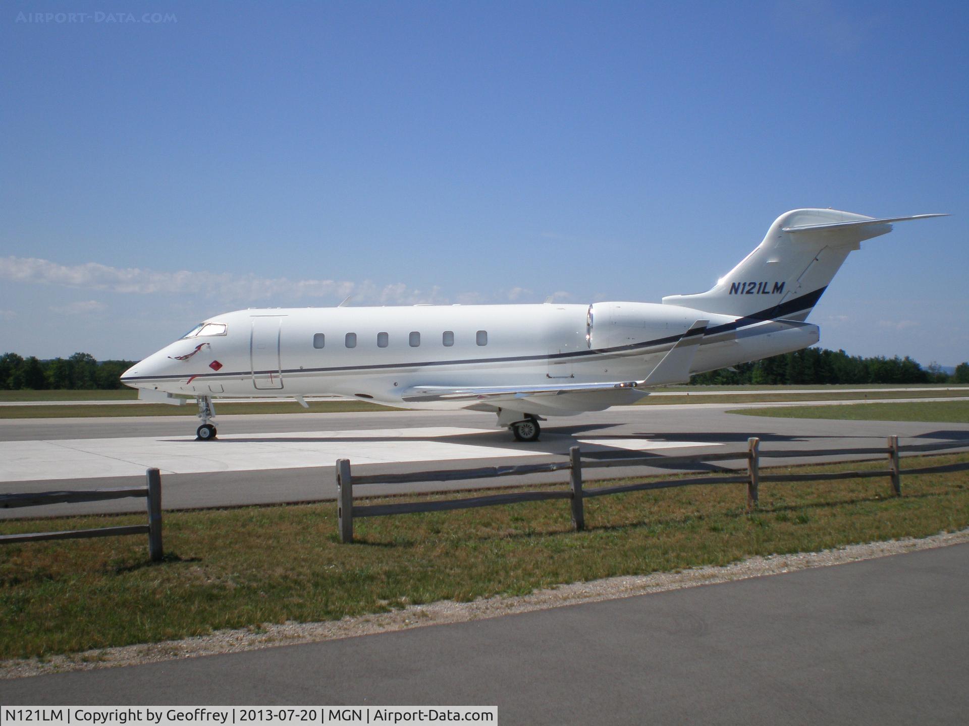 N121LM, 2004 Bombardier Challenger 300 (BD-100-1A10) C/N 20028, Perfect day for flying or riding a bike