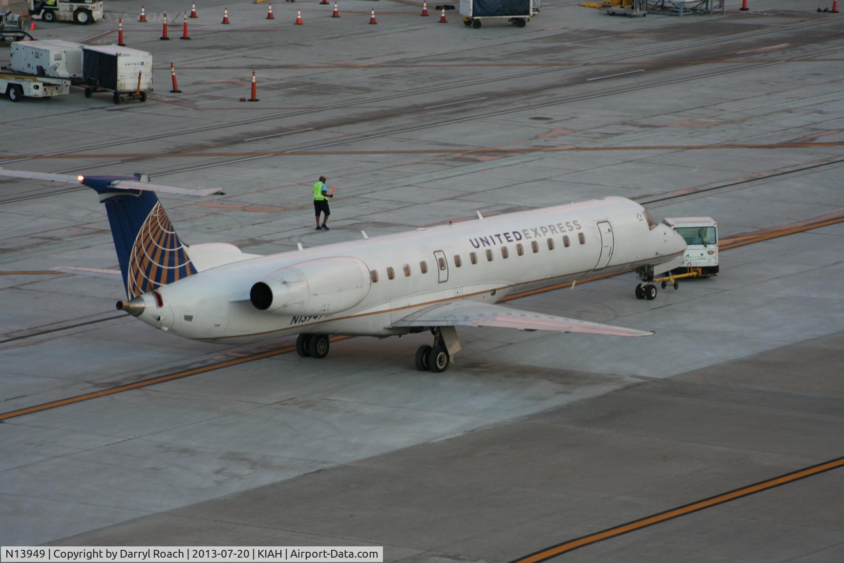 N13949, 1998 Embraer EMB-145LR C/N 145057, UAL E145 is unhooked for dept.
