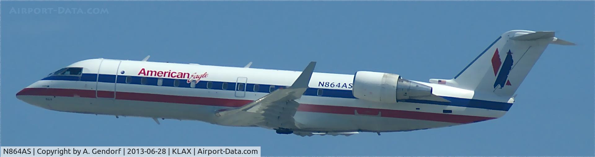 N864AS, 2001 Bombardier CRJ-200ER (CL-600-2B19) C/N 7502, American Eagle, seen here taking off RWY 25R at Los Angeles Int´l(KLAX)