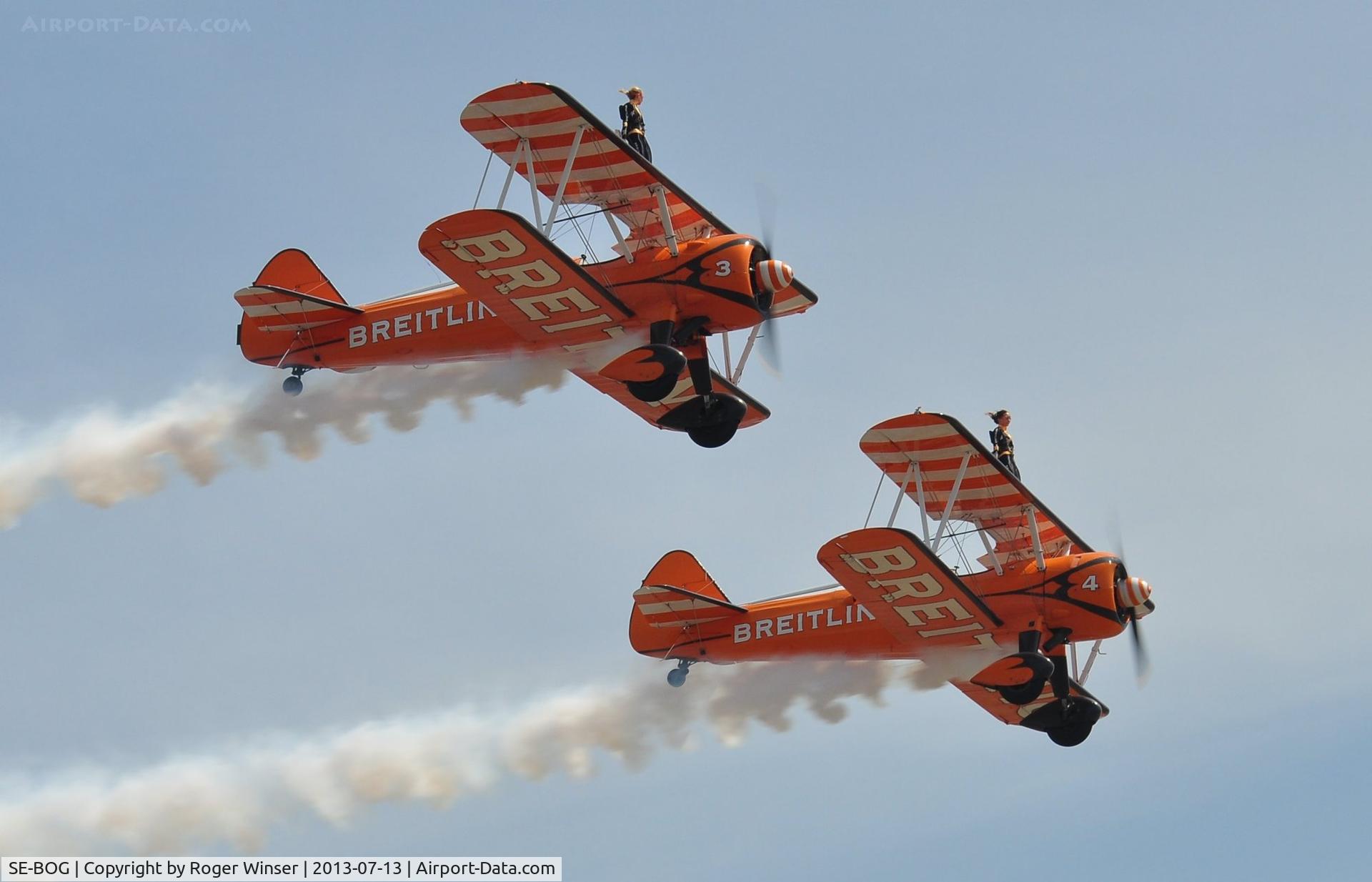 SE-BOG, 1942 Boeing N2S-3 Kaydet (B75N1) C/N 75-7128, Off airport. Breitling Wingwalkers with SE-BOG (3) in line abreast formation with N707TJ (4) displaying on the first day of the Wales National Air Show, Swansea Bay, UK.