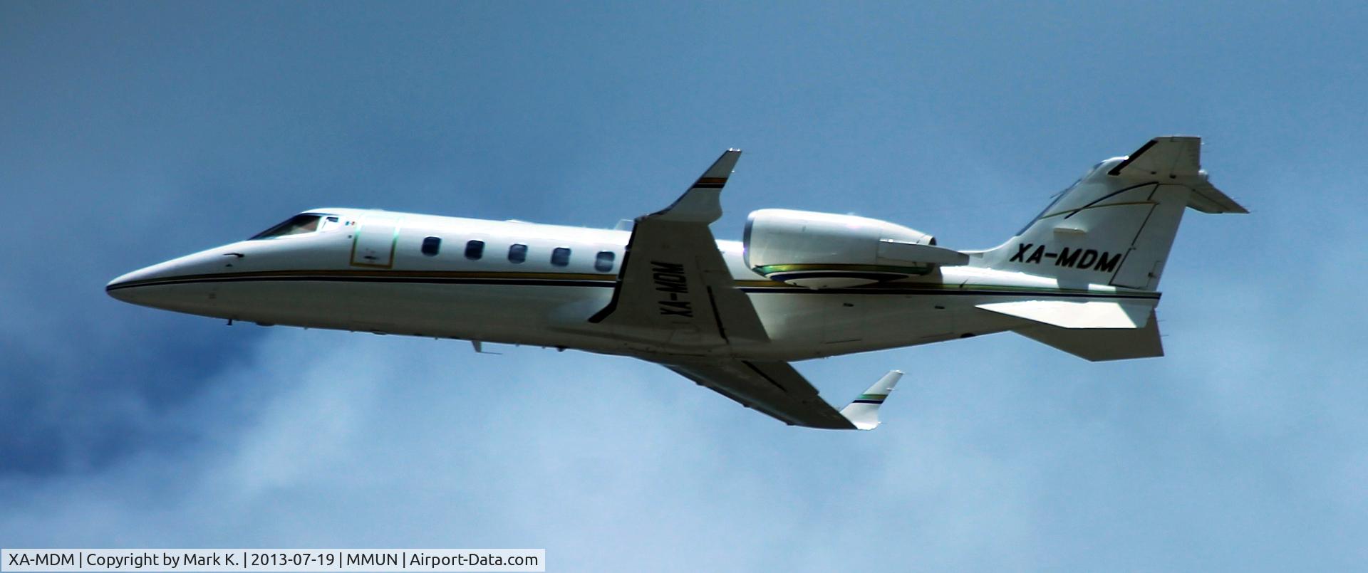 XA-MDM, 1996 Learjet 60 C/N 60-089, Learjet 60 departs on runway 12R.