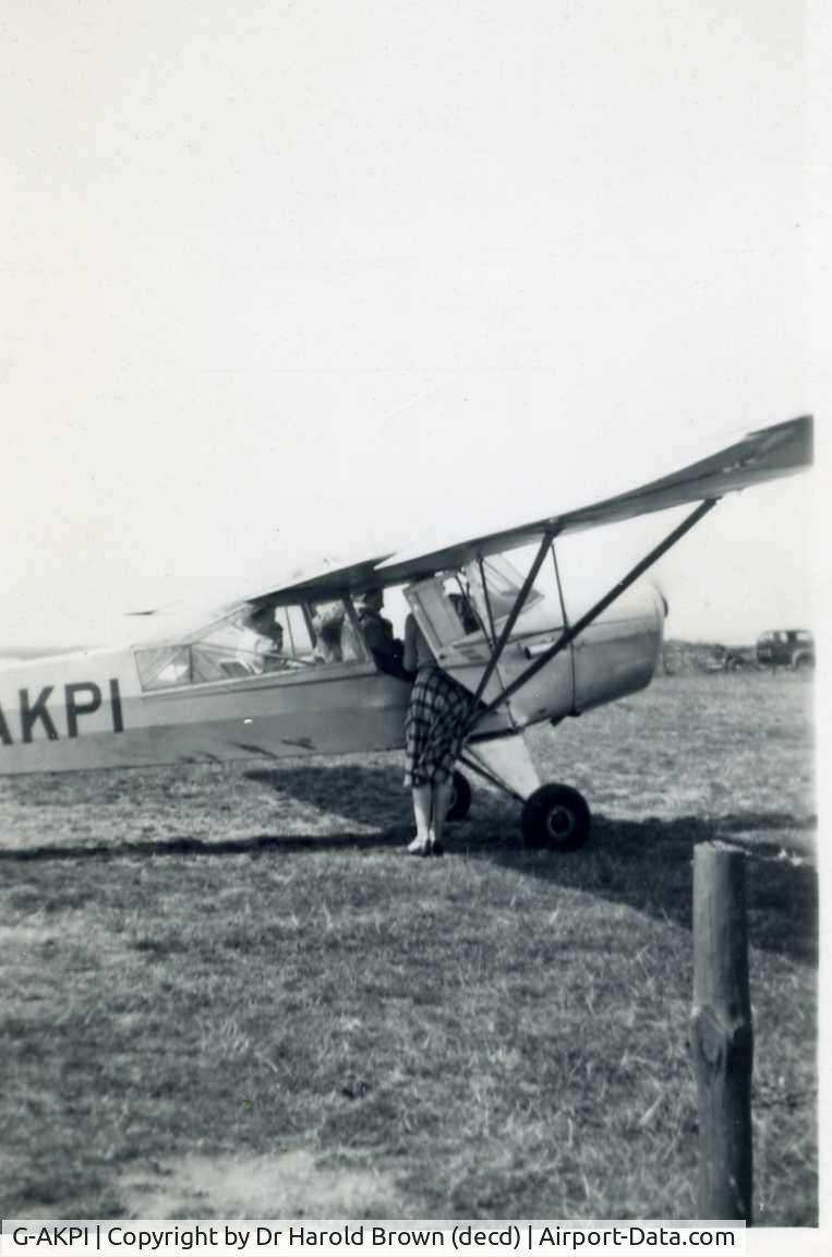 G-AKPI, 1944 Taylorcraft J Auster 5 C/N 1088, My brother in law, Alan Brown, having a pleasure flight probably at Sywell, Northants circa 1959. Mrs I M Brown, decd, in aircraft doorway.