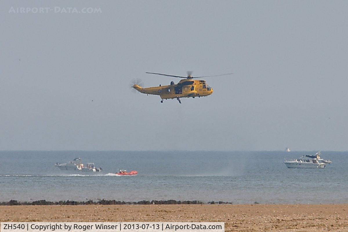 ZH540, Westland Sea King HAR.3A C/N WA1006, Off airport. SAR Sea King of 22 Squadron RAF exercising with the Mumbles Inshore RIB on the first day of the Wales National Air Show, Swansea Bay, UK.