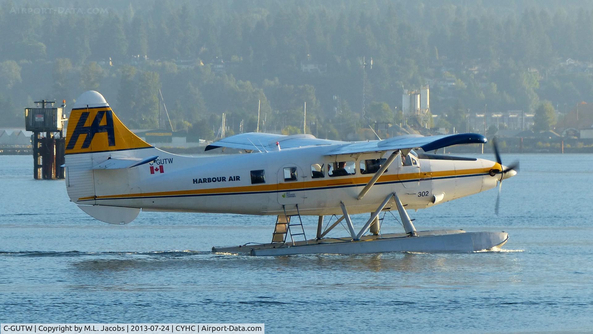 C-GUTW, 1960 De Havilland Canada DHC-3 Turbo Otter Otter C/N 405, Harbour Air #302 with an early morning departure in Coal Harbour.