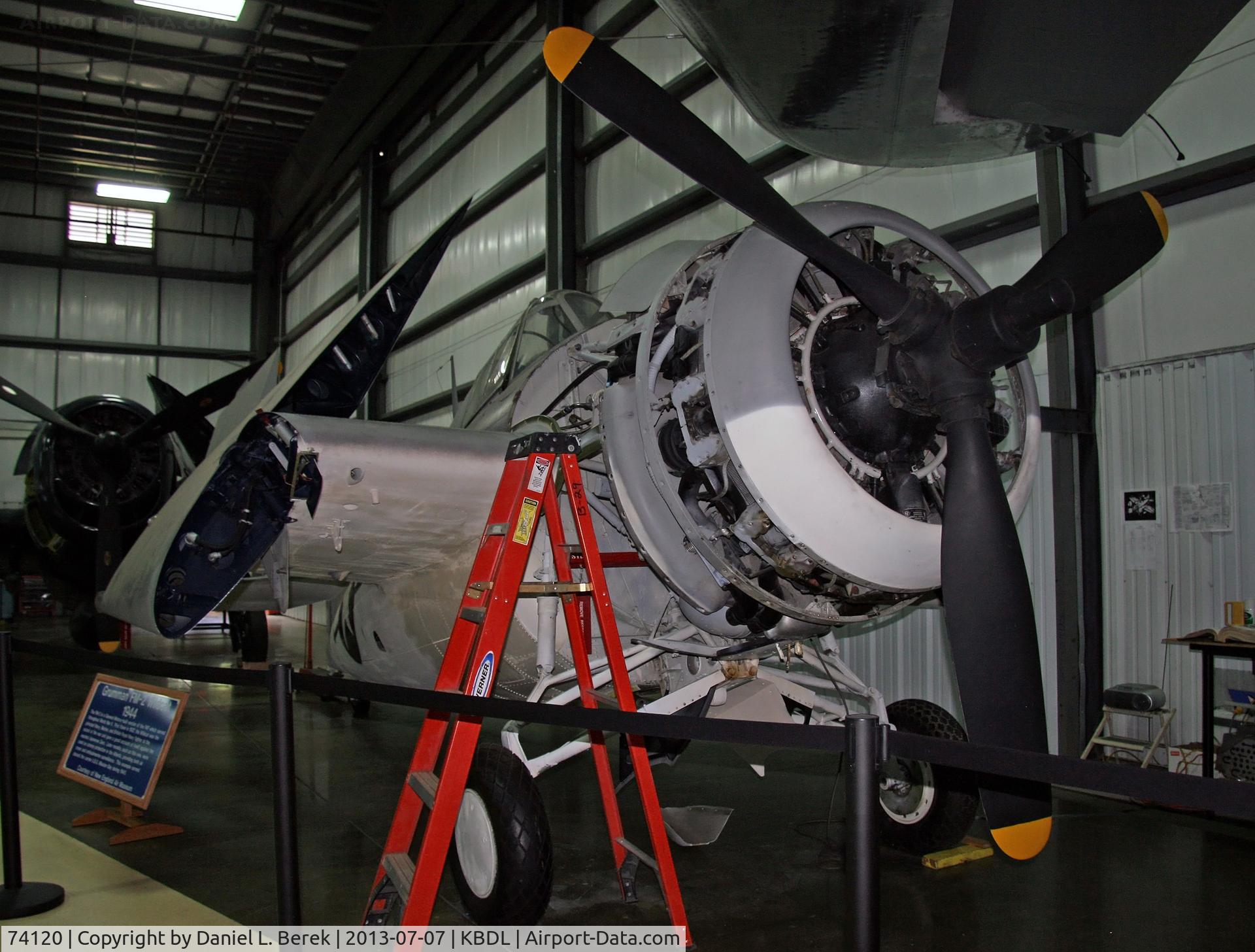 74120, 1944 General Motors (Grumman) FM-2 Wildcat C/N 4312, The New England Air Museum's newly acquired Wildcat receives some attention.  This aircraft actually served aboard the SS Mission Bay (CVE-59) in the Atlantic Theater. The FM-2 was a General Motors-built aircraft with aerodynamic improvements over the F-4
