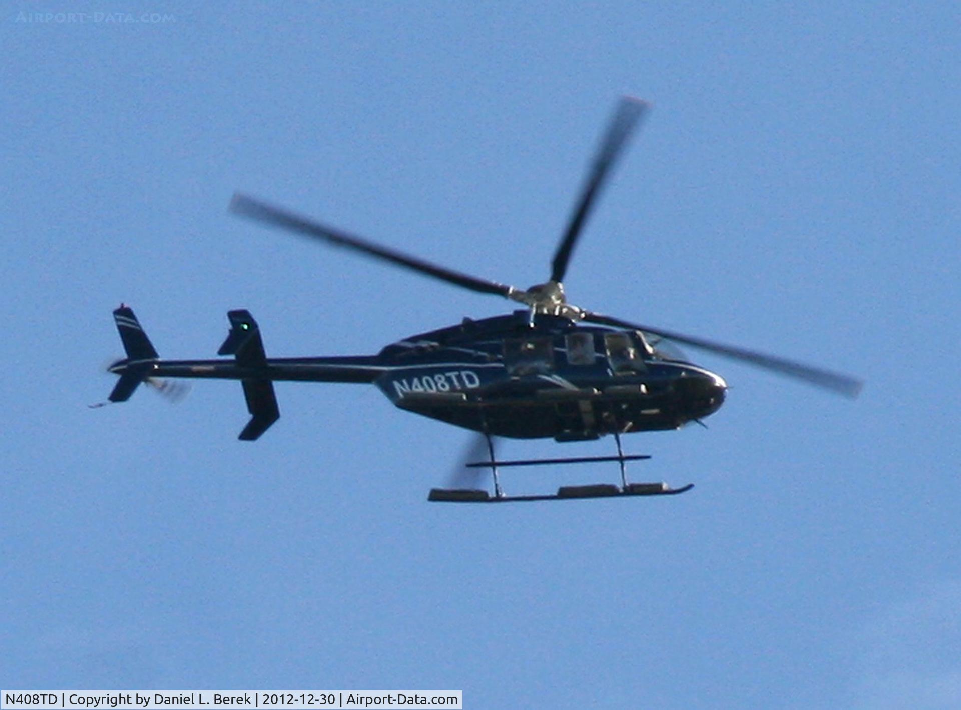 N408TD, 2007 Bell 407 C/N 53771, Hovering over the East River.