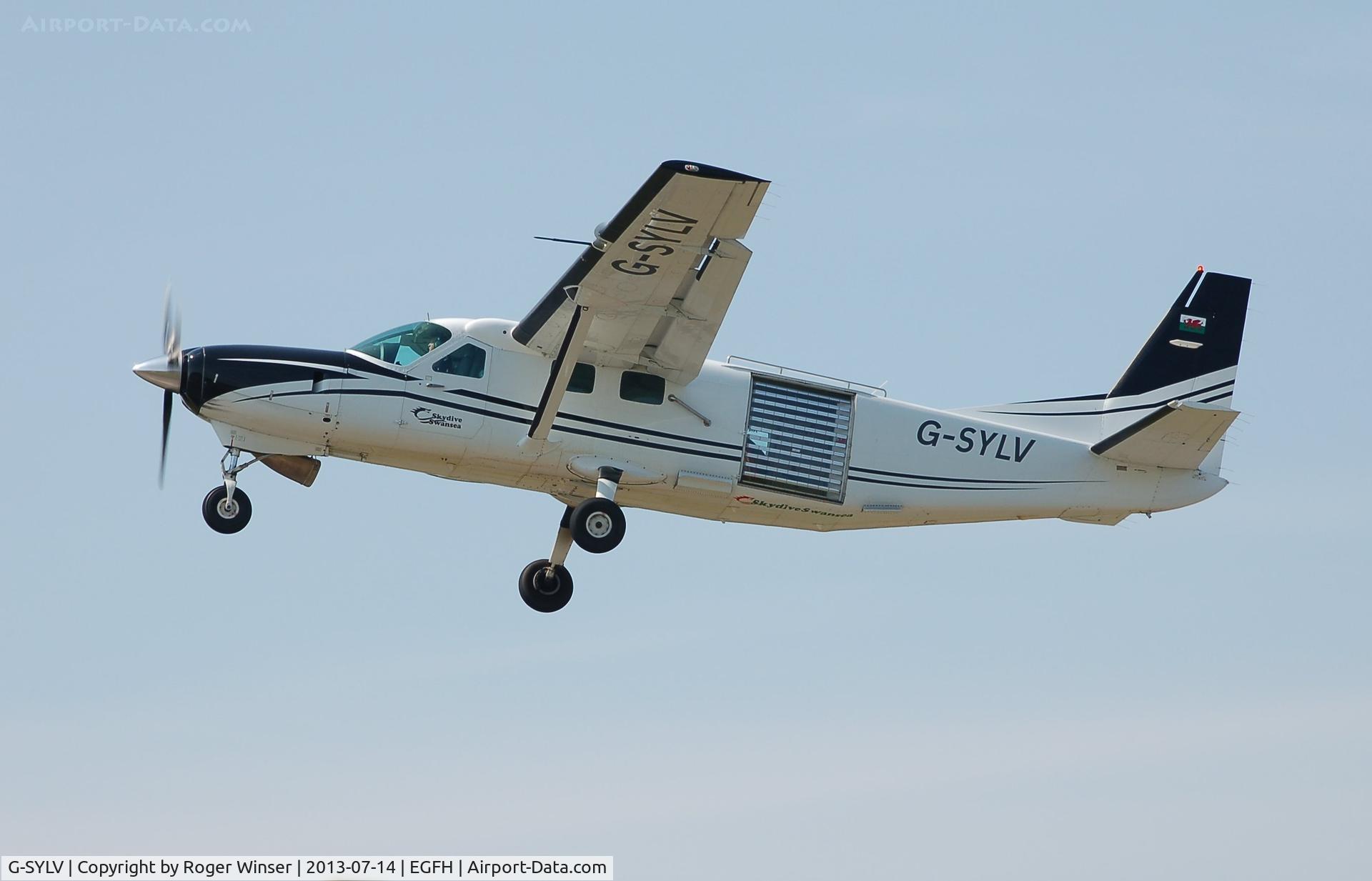 G-SYLV, 2002 Cessna 208B  Grand Caravan C/N 208B0936, Resident Grand Caravan departing to drop members of the British Army Tigers parachute team on the second day of the Wales National Air Show, Swansea Bay.