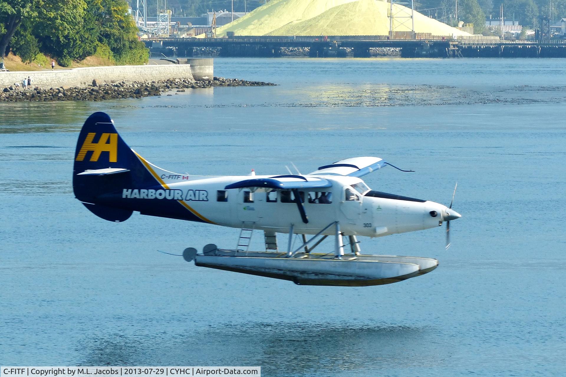 C-FITF, 1955 De Havilland Canada DHC-3T Vazar Turbine Otter C/N 89, Harbour Air #303 landing in Coal Harbour.