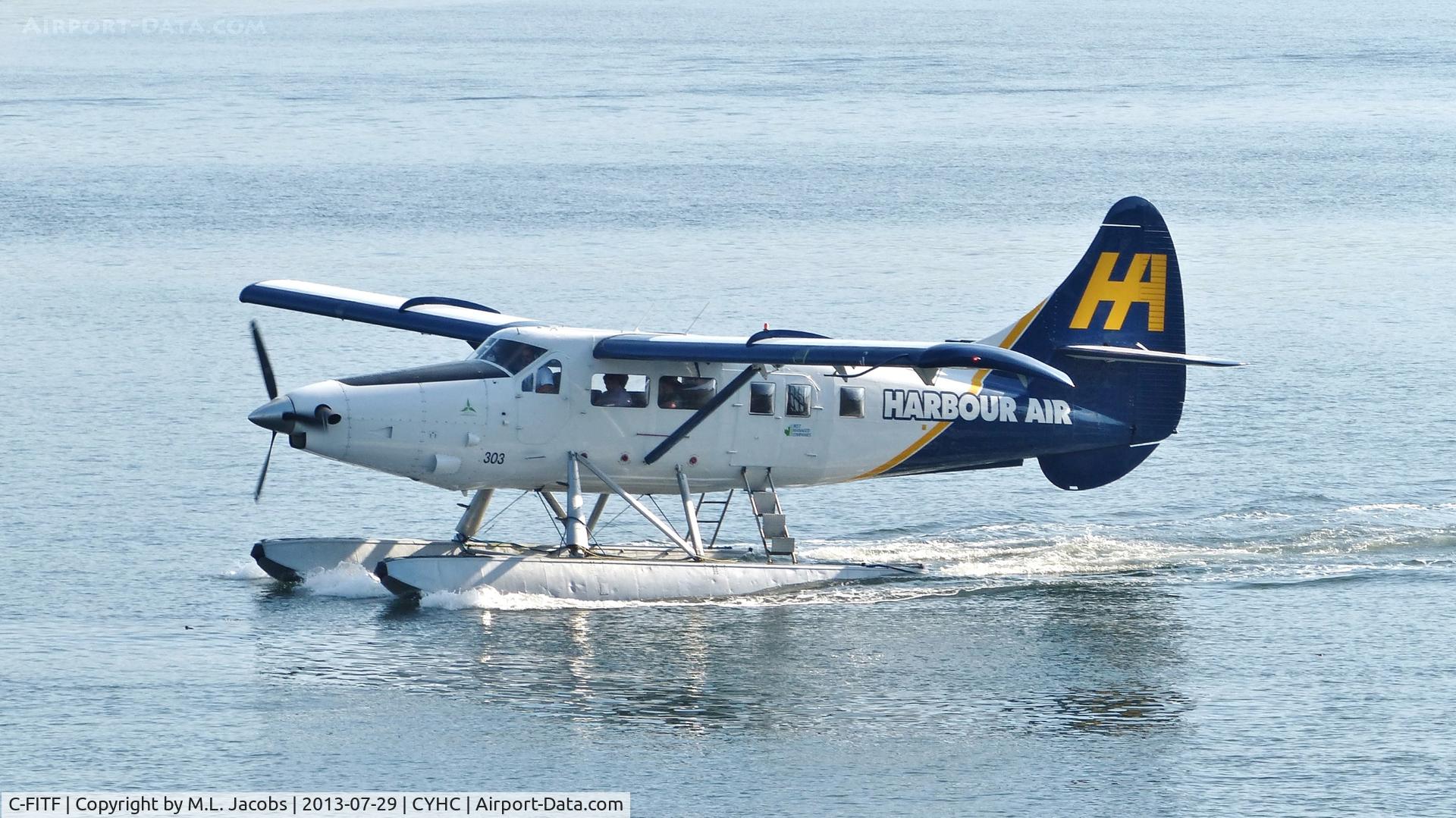 C-FITF, 1955 De Havilland Canada DHC-3T Vazar Turbine Otter C/N 89, Harbour Air #303 taxiing to terminal in Coal Harbour.