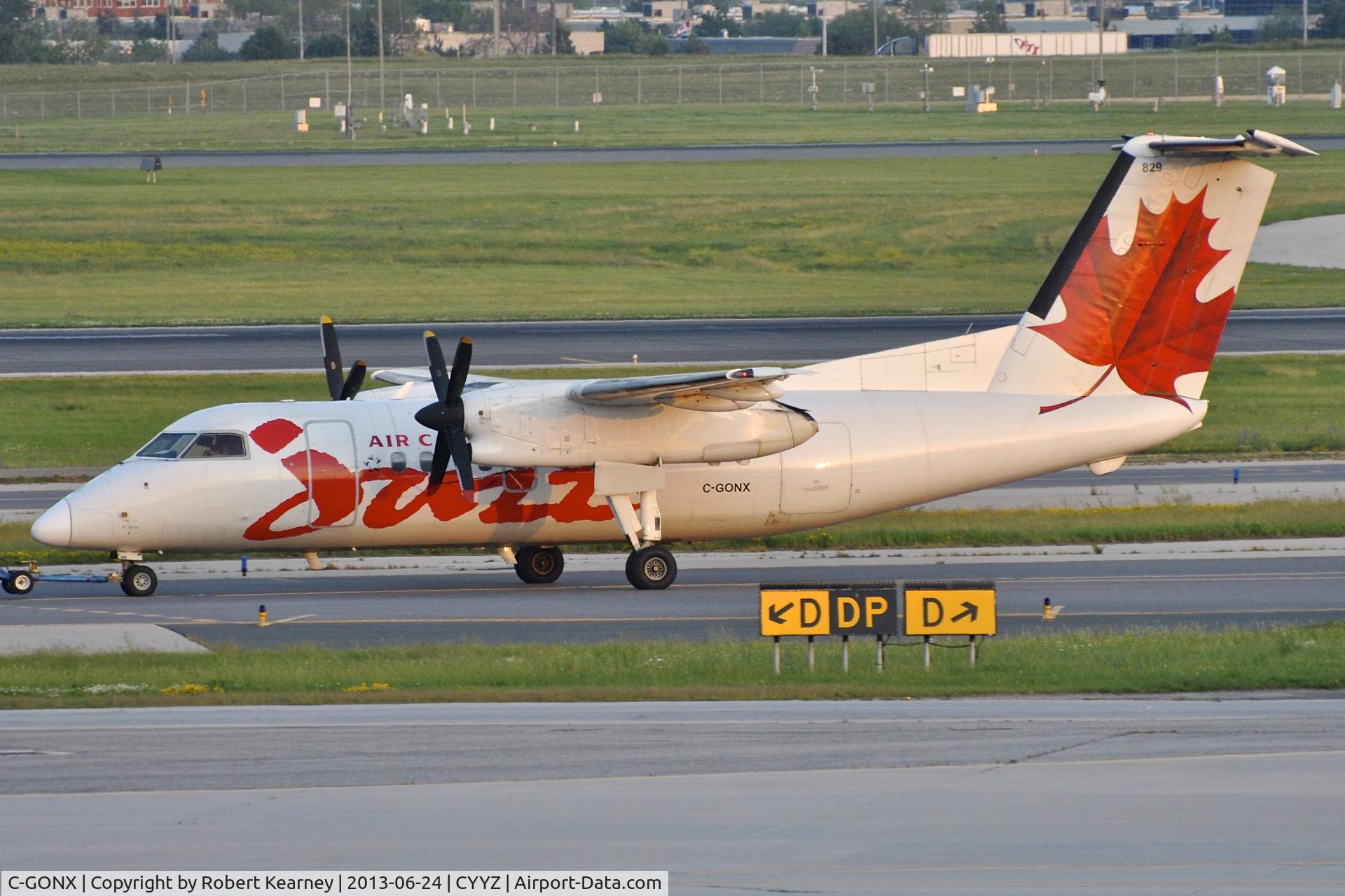 C-GONX, 1988 De Havilland Canada DHC-8-102 Dash 8 C/N 118, On tow to parking