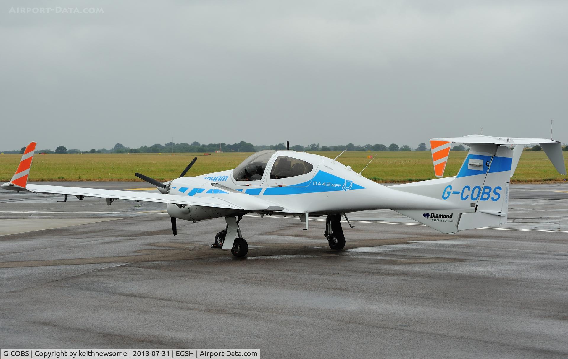 G-COBS, 2011 Diamond DA-42M-NG Twin Star C/N 42.MN020, Sitting in the rain !