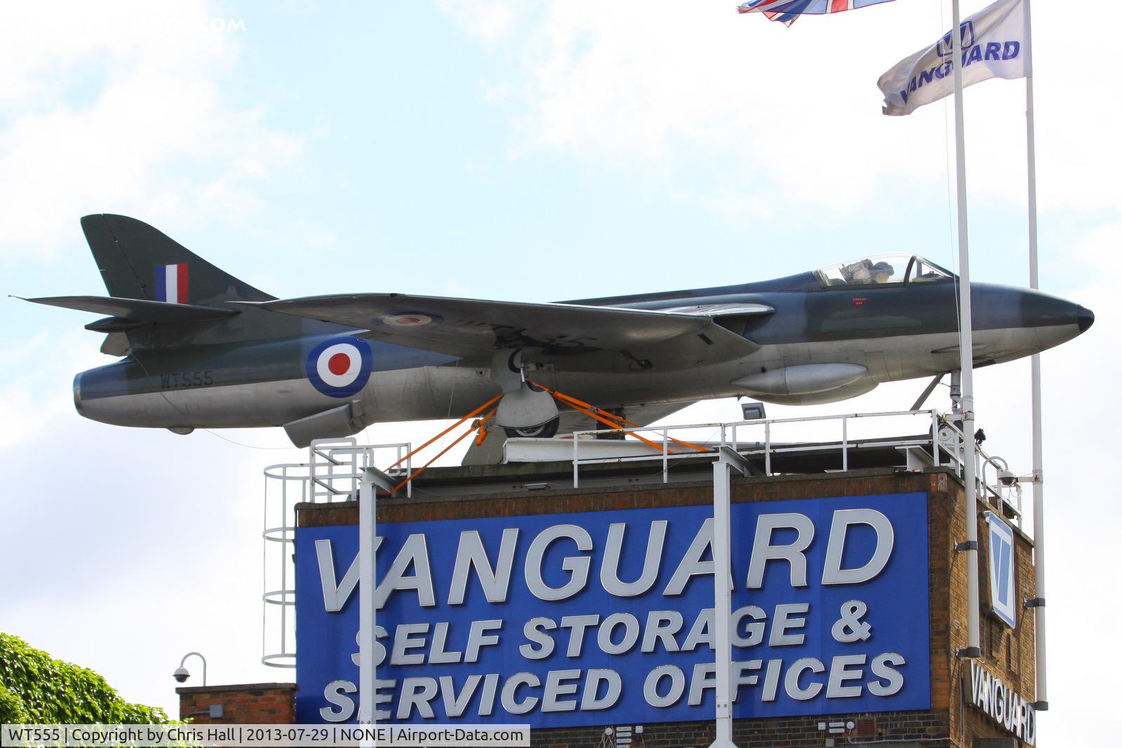 WT555, 1953 Hawker Hunter F.1 C/N 41H-665405, The first production F.1, built at Dunsfold in 1953, Vanguard Haulage bought it over 20 years ago and occasionally displayed it on their rooftop, for a few months in 1990, and in 2004 before putting it into storage. now back on the roof again.