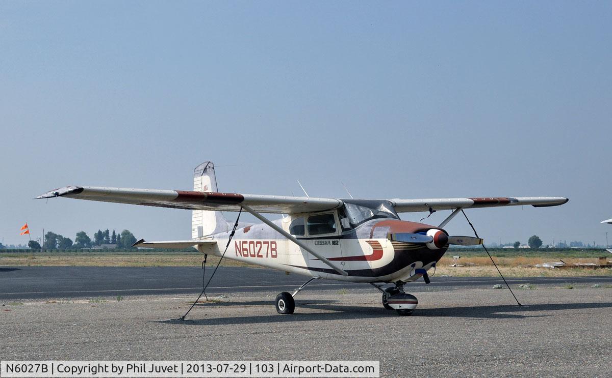 N6027B, 1957 Cessna 182A Skylane C/N 34027, Tied down at Lodi Airport, California. Paint in poor condition.