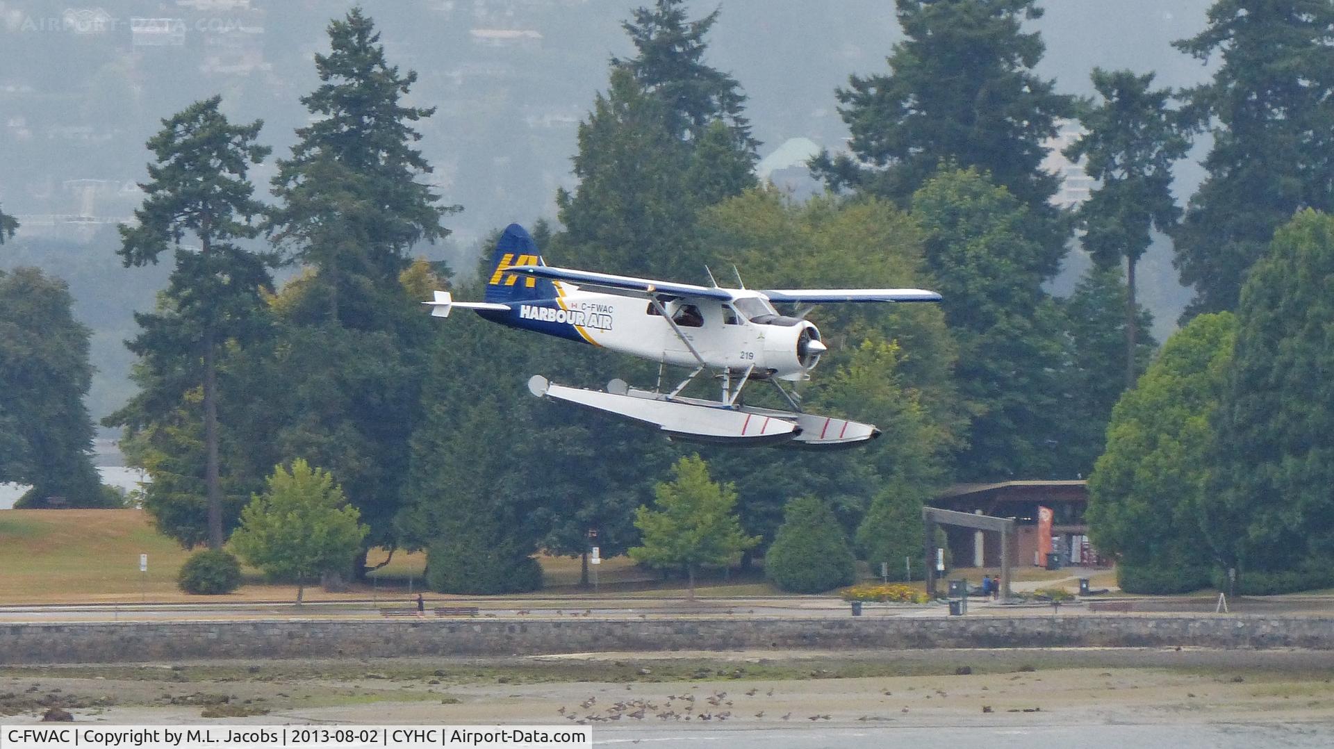 C-FWAC, 1959 De Havilland Canada DHC-2 Beaver Mk. I C/N 1356, Harbour Air #219 landing in Coal Harbour on a rainy morning.