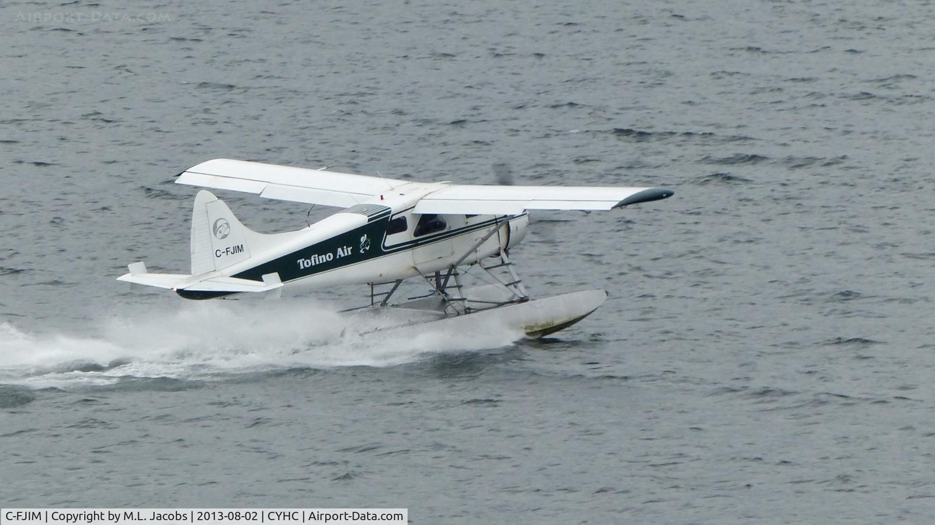 C-FJIM, 1952 De Havilland Canada DHC-2 Beaver Mk.1 C/N 461, Tofino Air Beaver taking off in the rain in Coal Harbour.