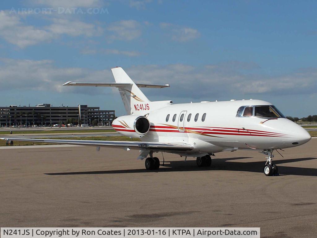 N241JS, 2004 Raytheon Hawker 800XP C/N 258652, This 2004 Hawker 800XP sits quietly at the general aviation parking on the east side of Tampa Int'l Airport