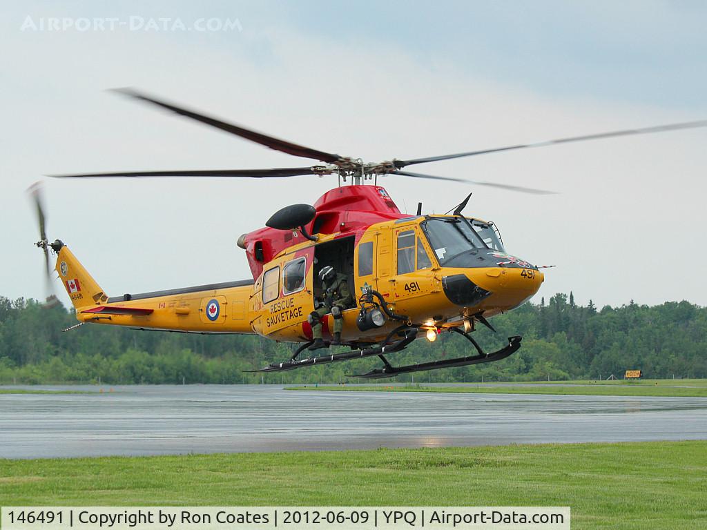 146491, Bell CH-146 Griffon C/N 46491, This 1997 Bell Griffon RCAF Rescue helicopter lands in Peterborough, Ontario for fuel.
