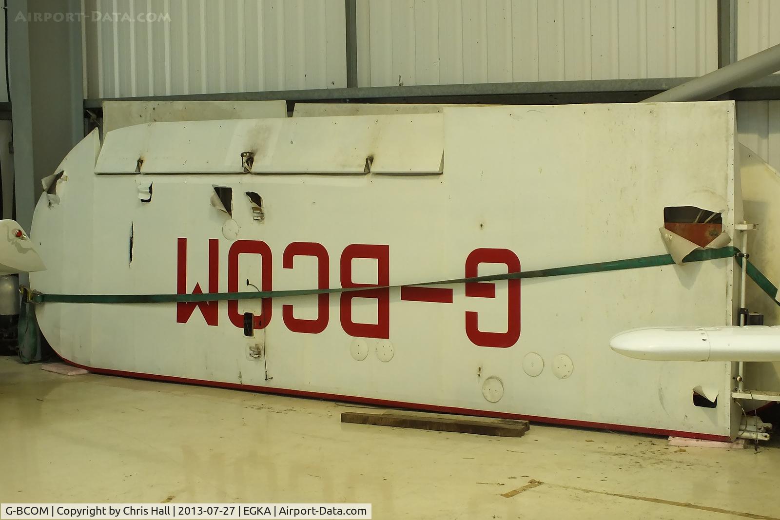 G-BCOM, 1944 Piper L-4H Grasshopper (J3C-65D) C/N 12040, wings off Piper J3C-65 Cub stored in a hangar at Shorham