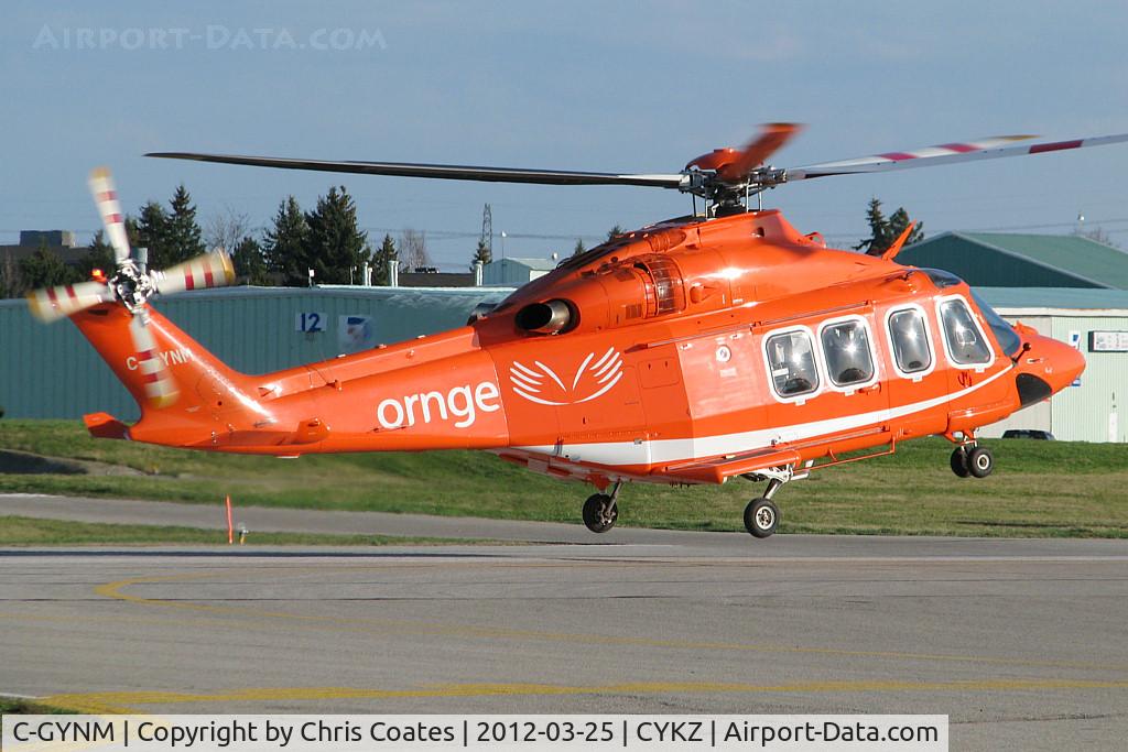 C-GYNM, 2010 AgustaWestland AW-139 C/N 41245, After a fuel stop, this bright helicopter was lifting off runway 21 for a short flight back to its base at the Toronto Island Airport (CYTZ). It's one of the new birds in the Ornge medivac fleet.