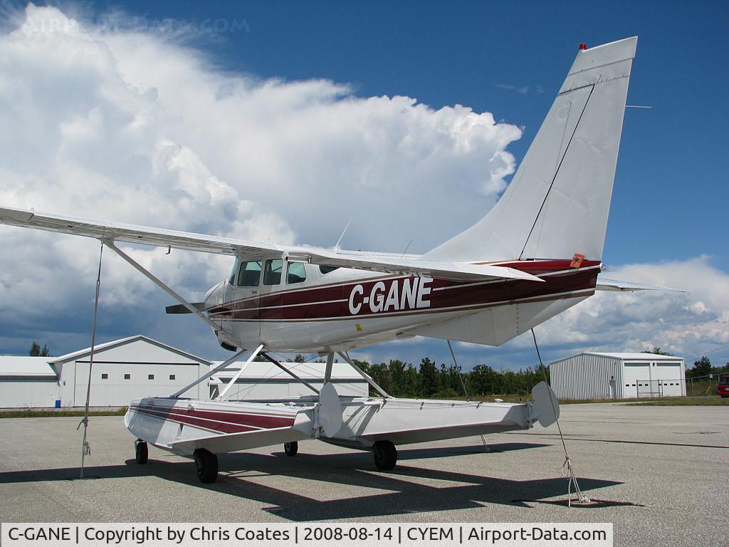 C-GANE, 1983 Cessna TU206G Turbo Stationair C/N U20606764, This Cessna was resting in the middle of the ramp as a wall of cumulus clouds approached from the north. Soon it had a cold bath! Today it lives far away at Fort Simpson in the Northwest Territories.