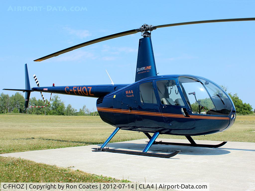 C-FHOZ, 2006 Robinson R44 II C/N 11089, This 2006 Robinson R44 II sits outside the Silverline Helicopters hanger at Holland Landing Airport (CLA4) north of Toronto