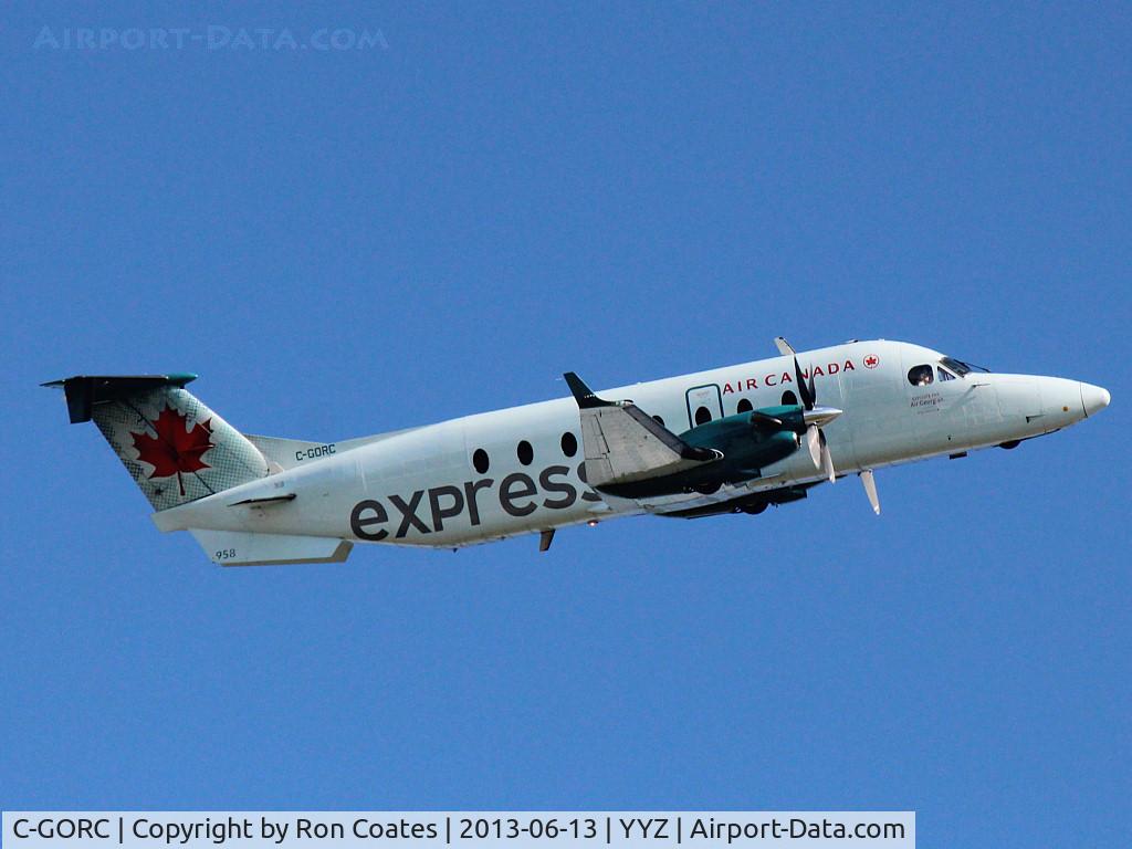 C-GORC, 1998 Beech 1900D C/N UE-320, 1998 Beech 1900D lifts off runway 23 into a cloudless sky at Toronto Int'l Airport (YYZ)