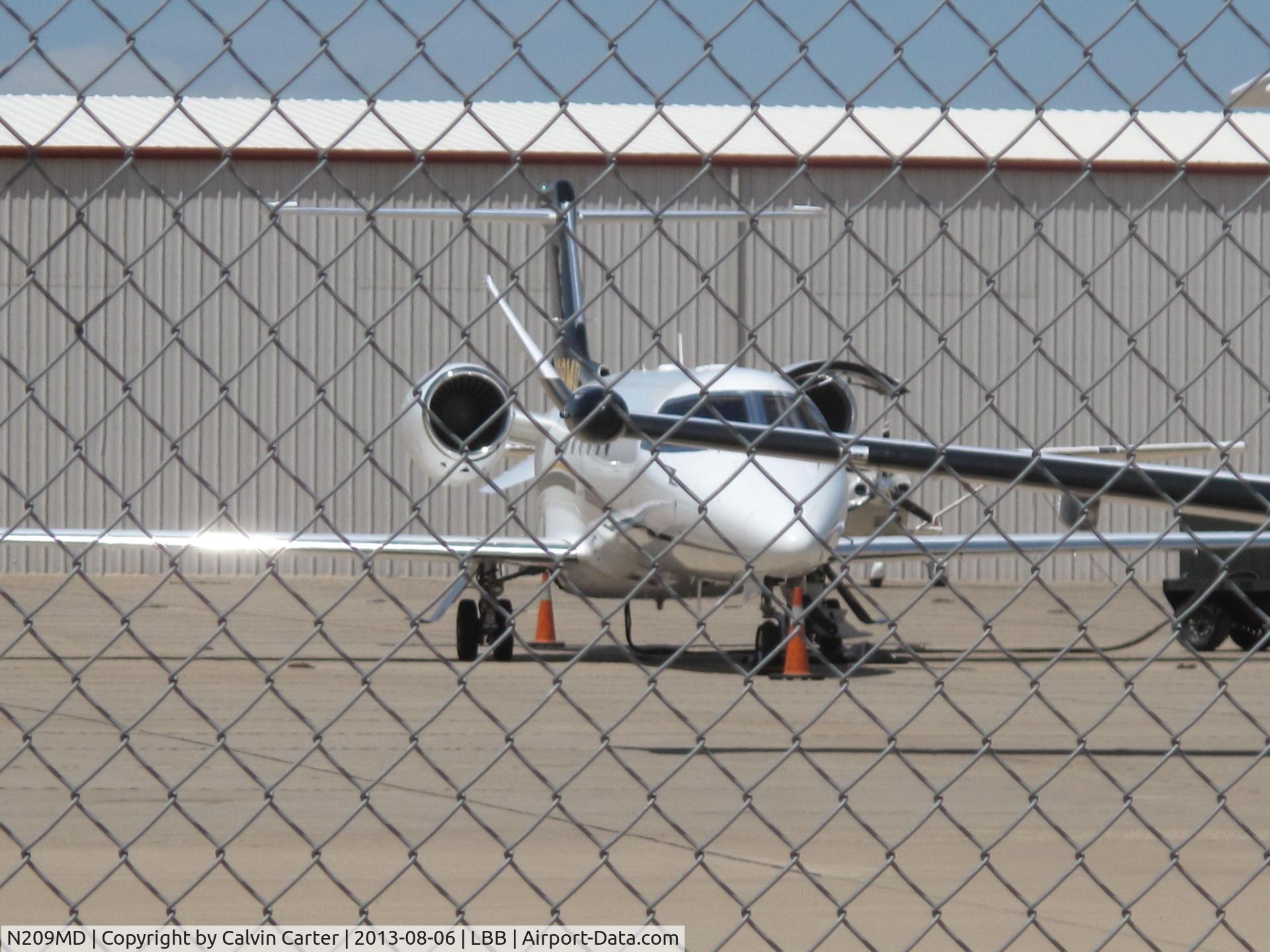 N209MD, Learjet Inc 45 C/N 2127, N209MD thru the chain link fence.