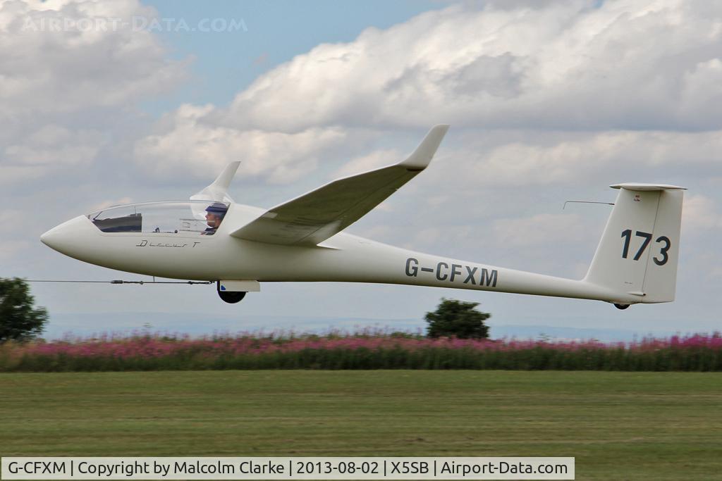 G-CFXM, 1983 Schempp-Hirth Discus bT C/N 16, Schempp-Hirth Discus BT being launched for a cross country flight during The Northern Regional Gliding Competition, Sutton Bank, North Yorks, August 2nd 2013.