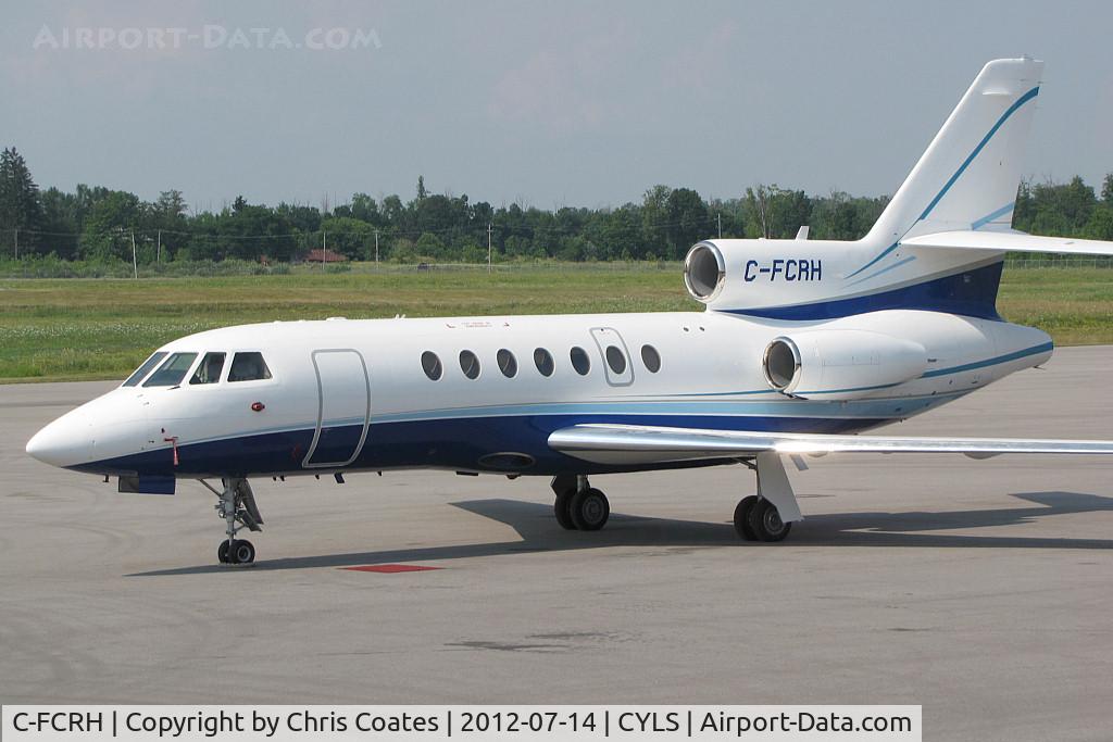 C-FCRH, 1981 Dassault Falcon 50 C/N 56, This Falcon 50 looked great in blue colours while resting on the terminal ramp at Lake Simcoe Regional. It was visiting from Calgary, Alberta. Its reg was once on a Hawker 800 bizjet.